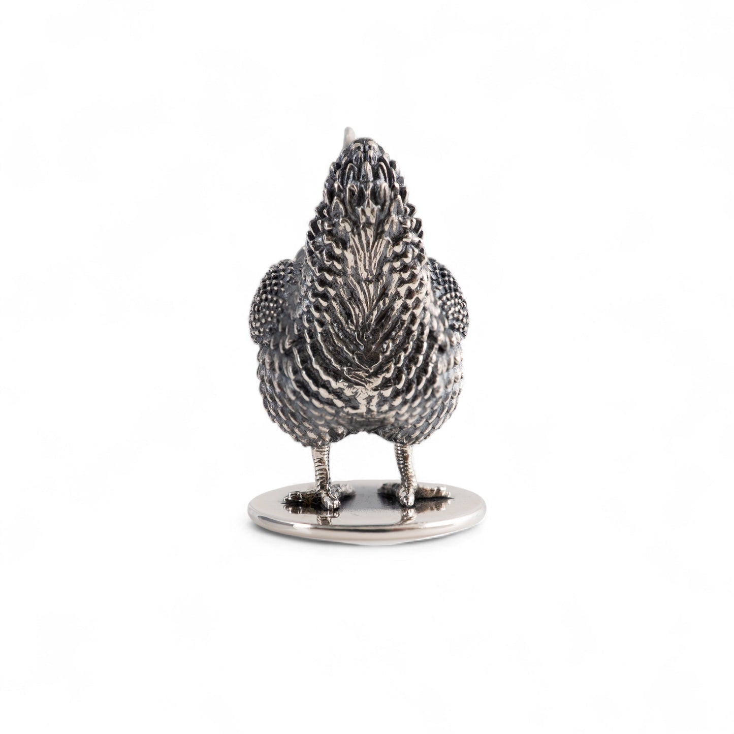 Silver hen figurine back view on a white background