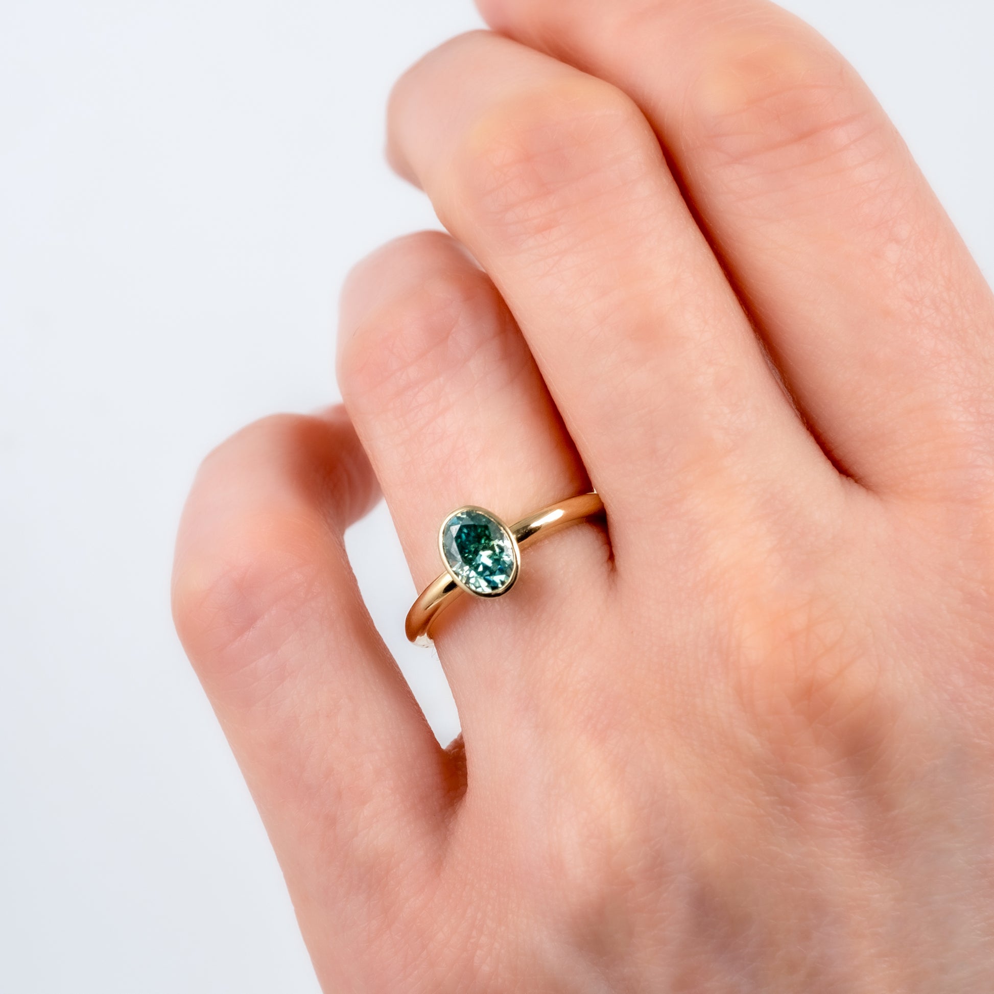 9ct Yellow Gold Teal Moissanite Oval Bezel Solitaire Ring - Hunters Fine Jewellery
