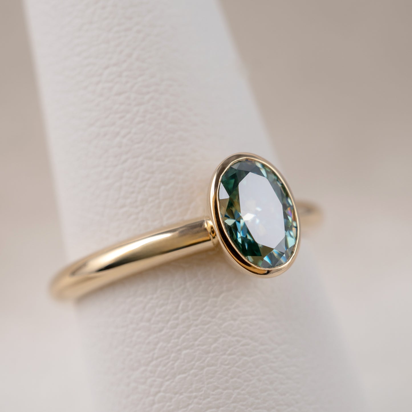 9ct Yellow Gold Teal Moissanite Oval Bezel Solitaire Ring - Hunters Fine Jewellery