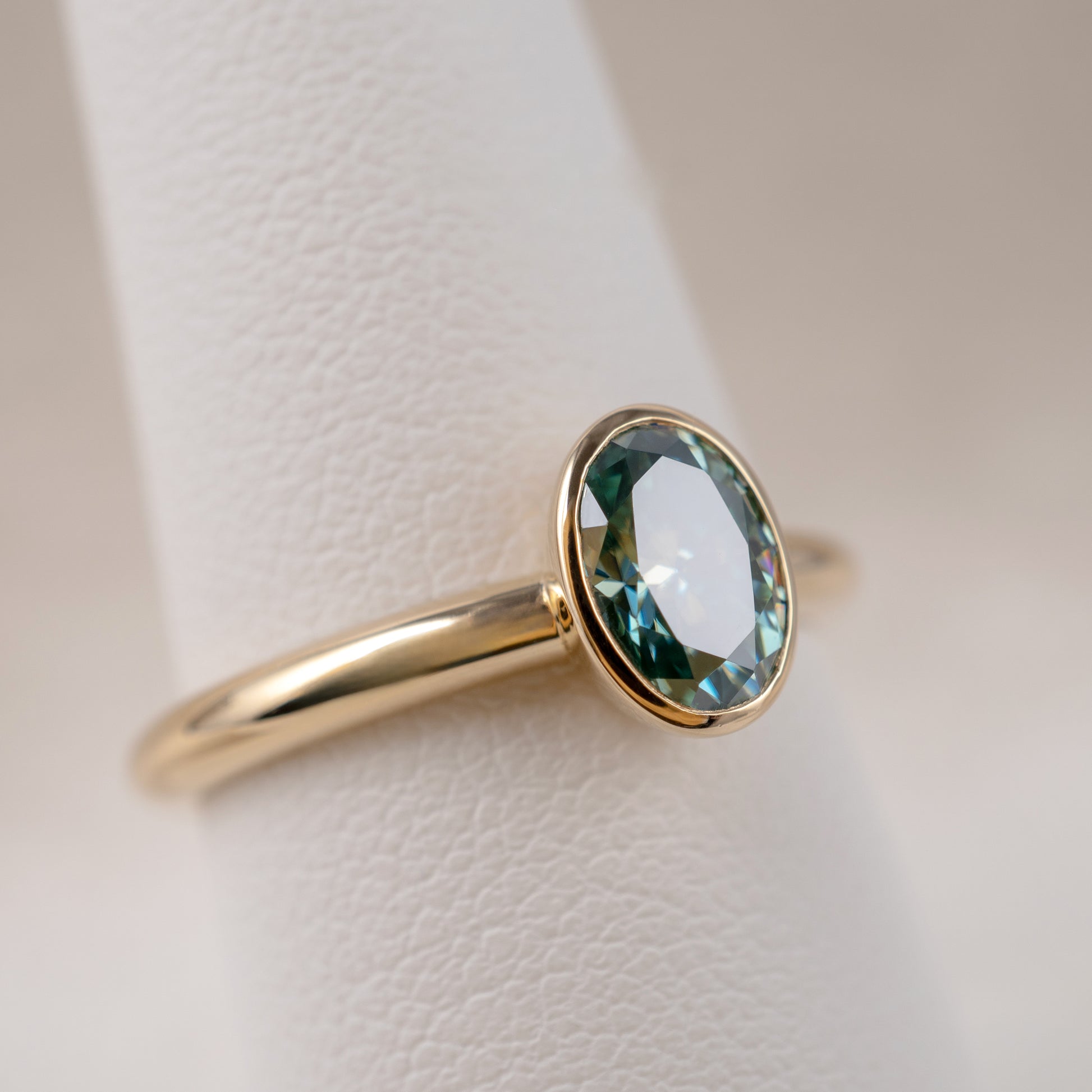 9ct Yellow Gold Teal Moissanite Oval Bezel Solitaire Ring - Hunters Fine Jewellery