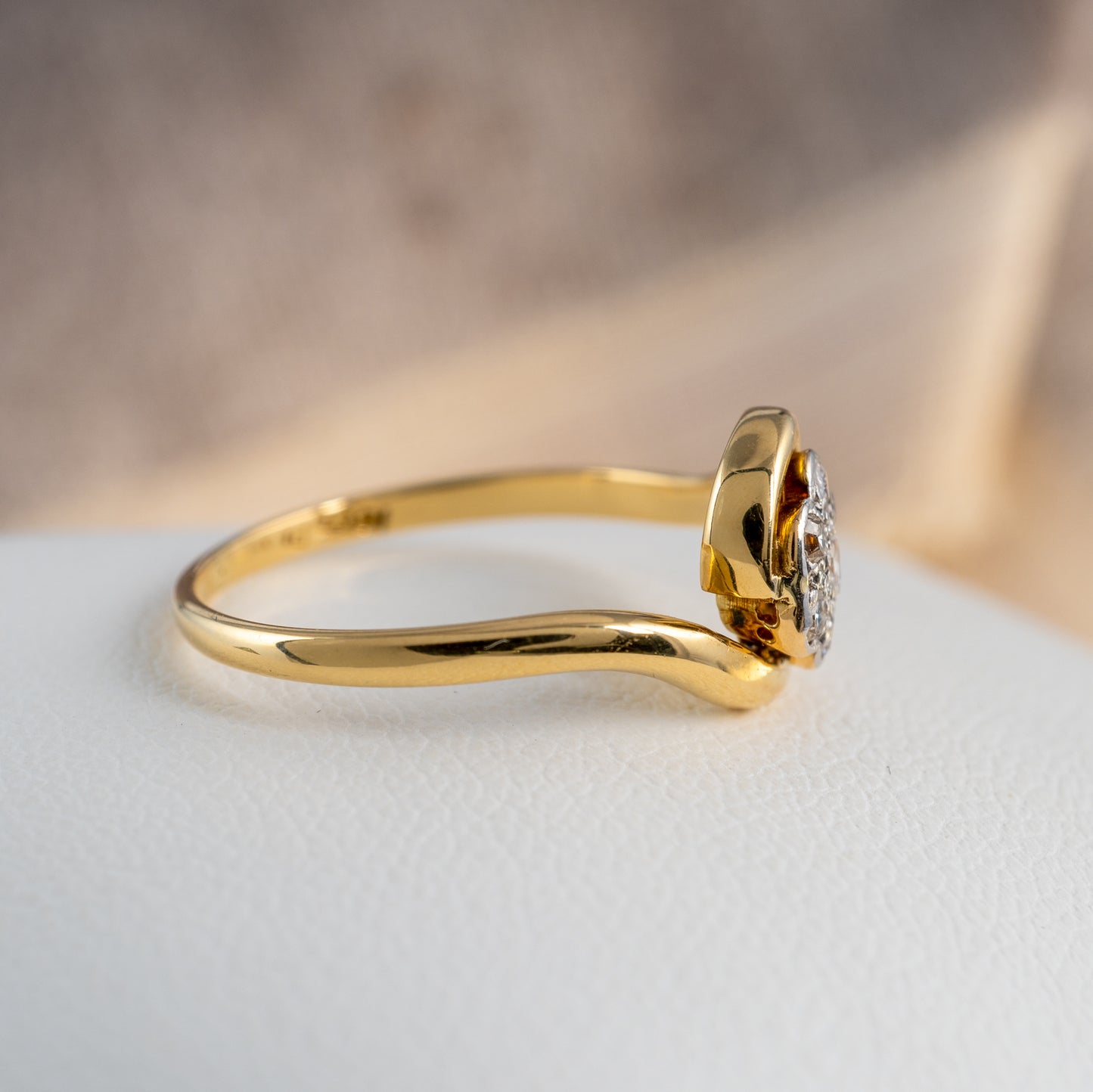 Side view of vintage diamond flower ring in 18ct yellow gold with platinum setting