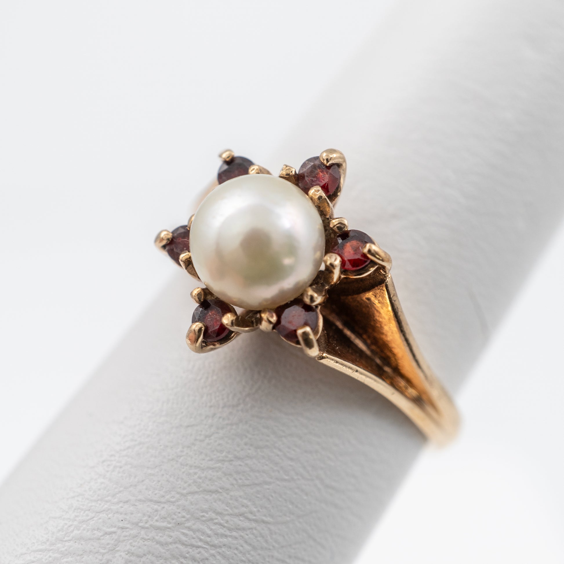 vintage garnet and pearl ring close up side