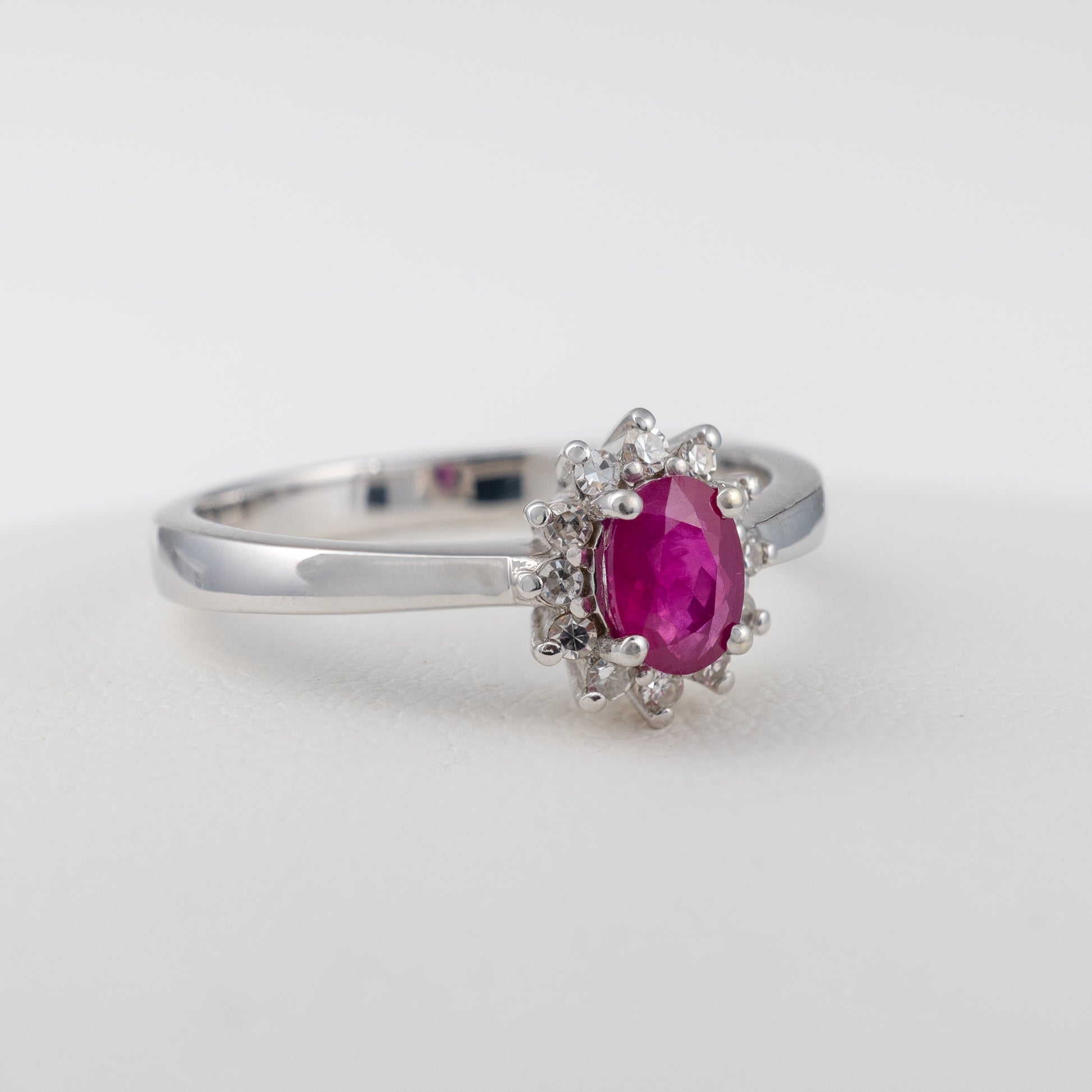 Ruby-Diamond-Halo-Ring-in-White-Gold-Side-Angle