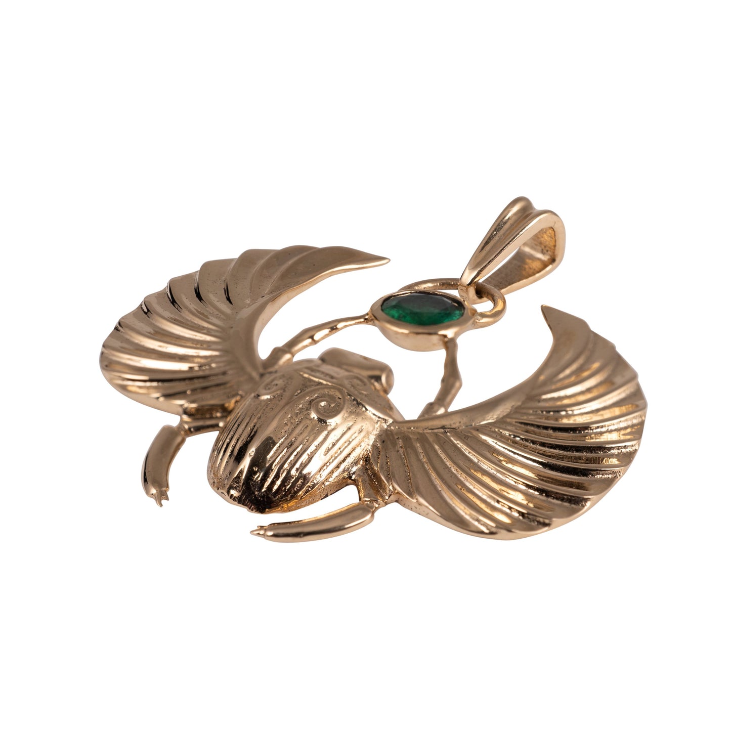 Close-up of lab-grown emerald set in gold scarab beetle necklace