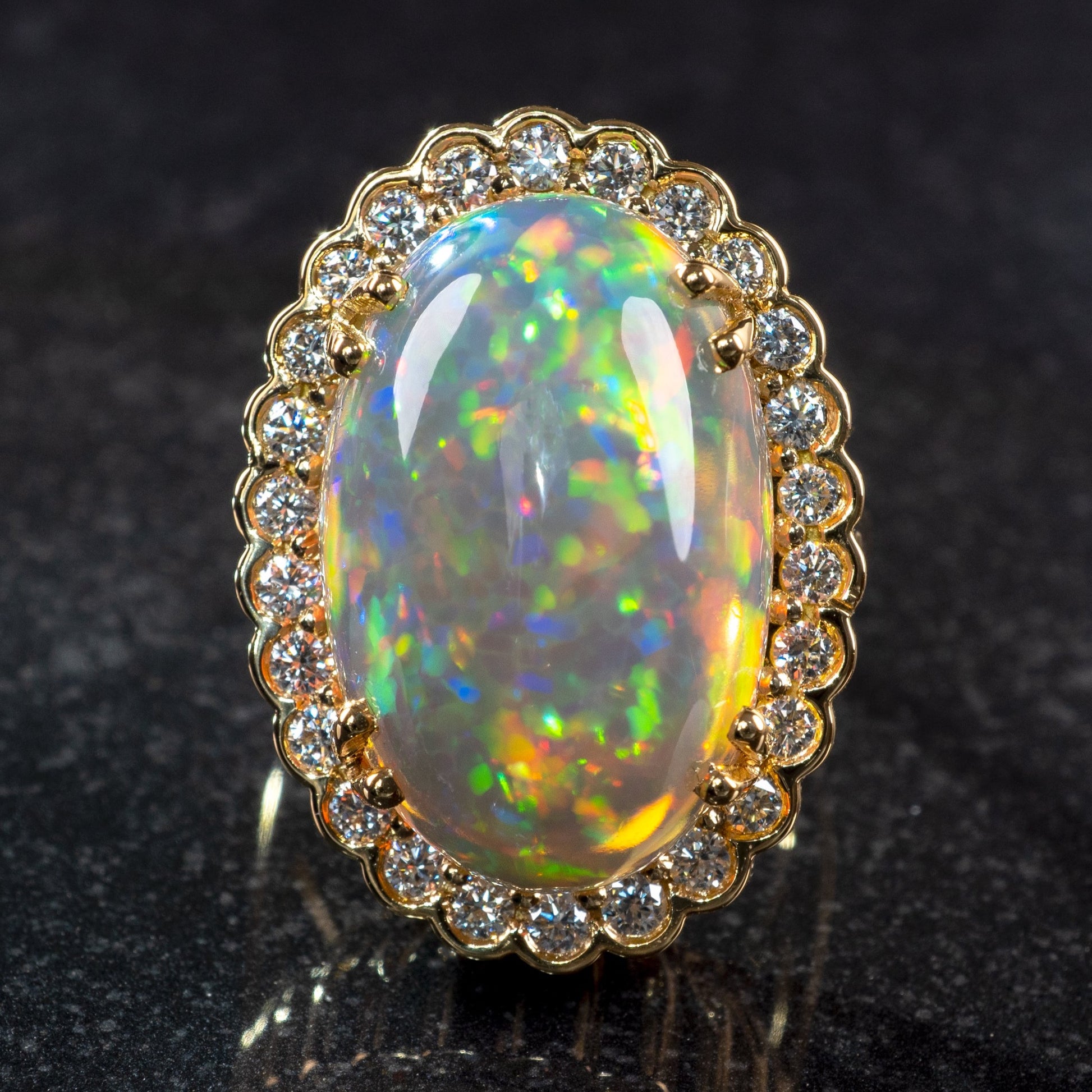 large size ethiopian opal ring gold and diamond halo front hunters fine jewellery