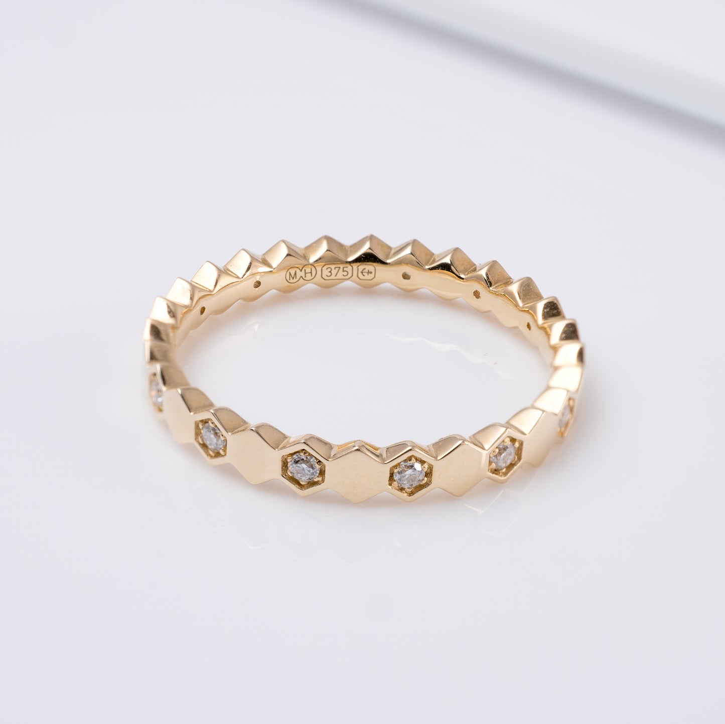 gold geometric eternity band