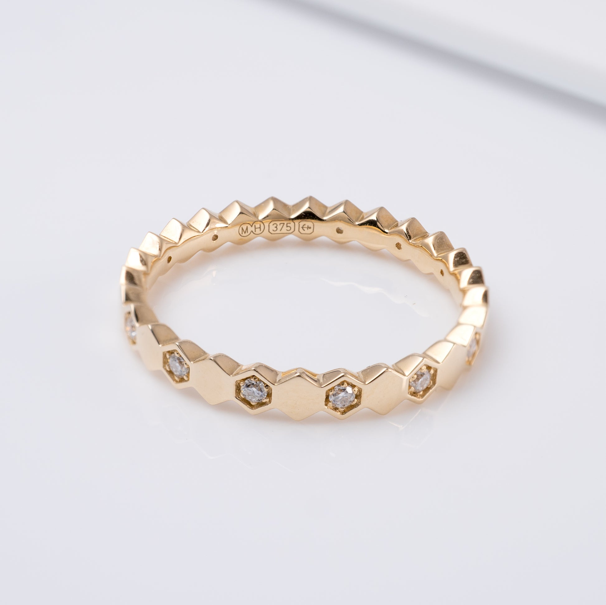 gold geometric eternity band