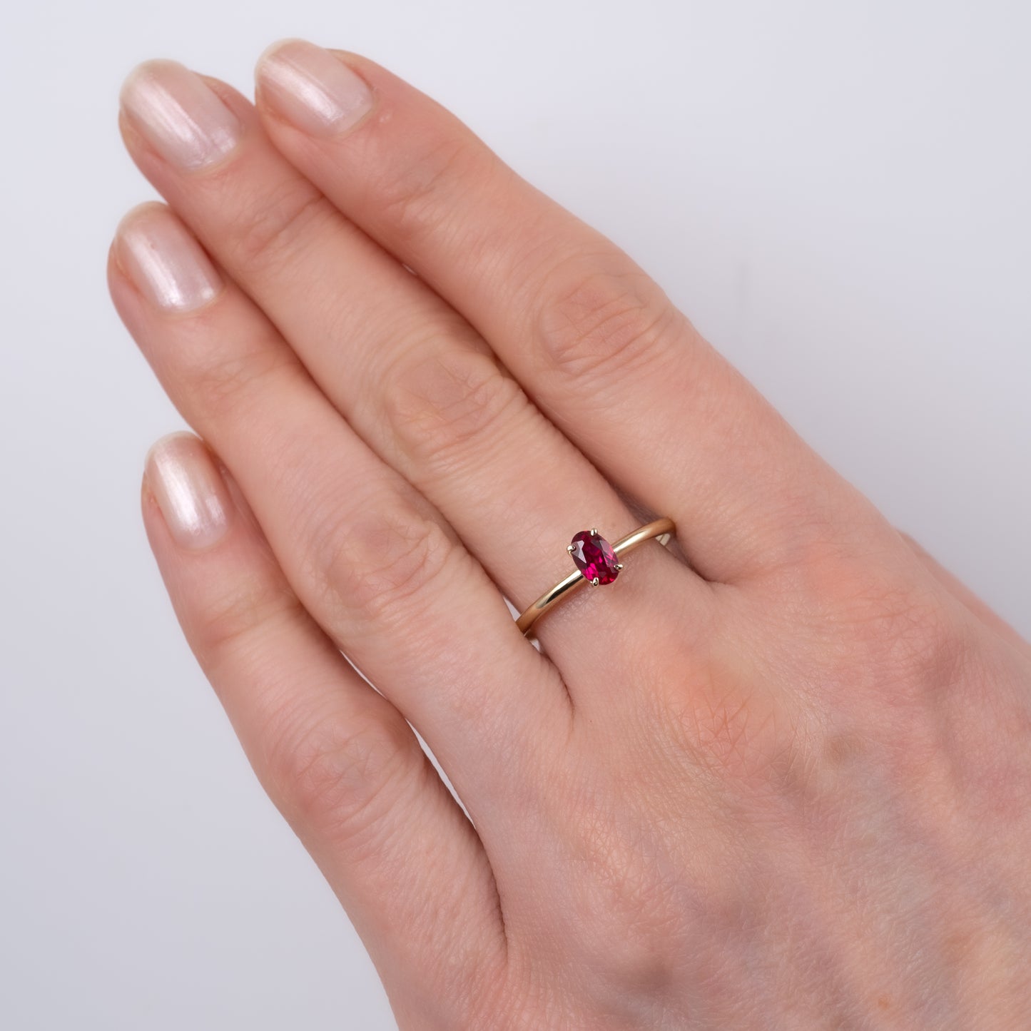 oval ruby prong ring yellow gold