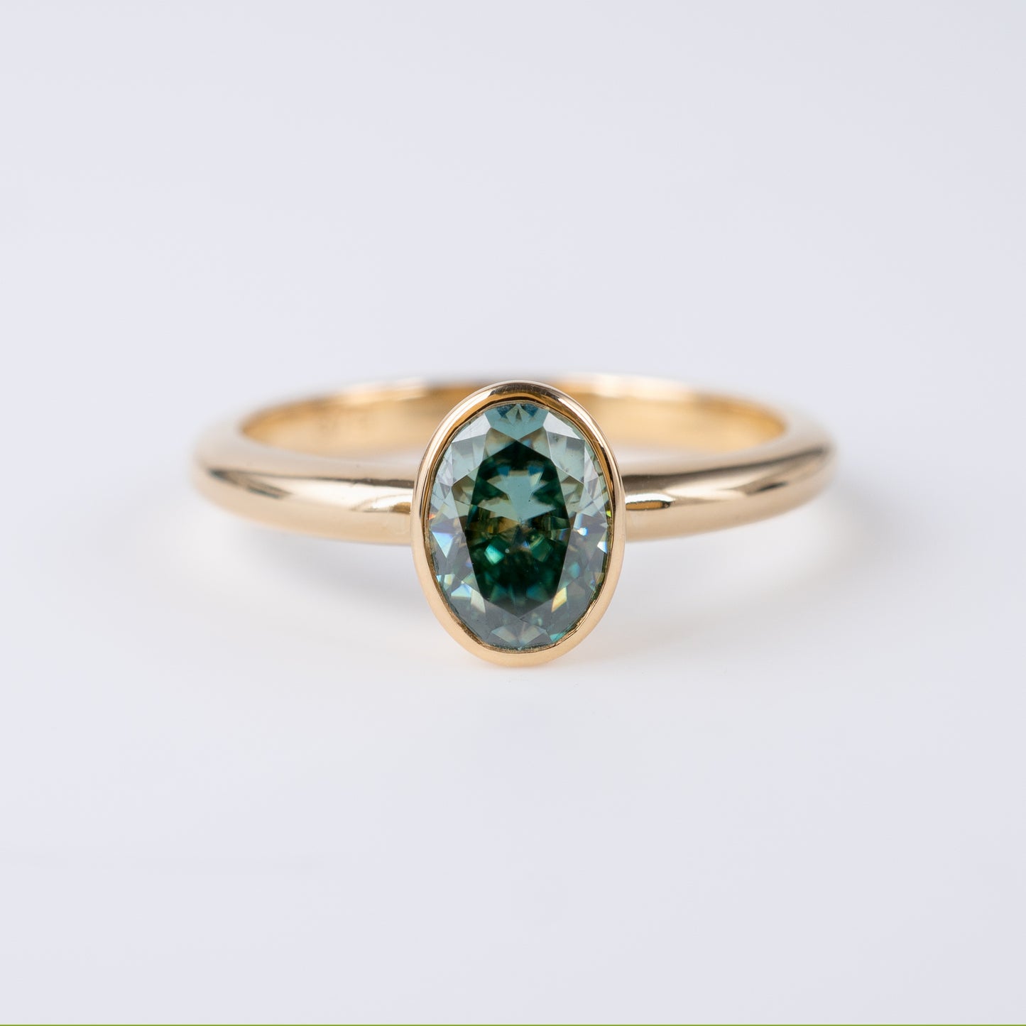 teal moissanite ring yellow gold