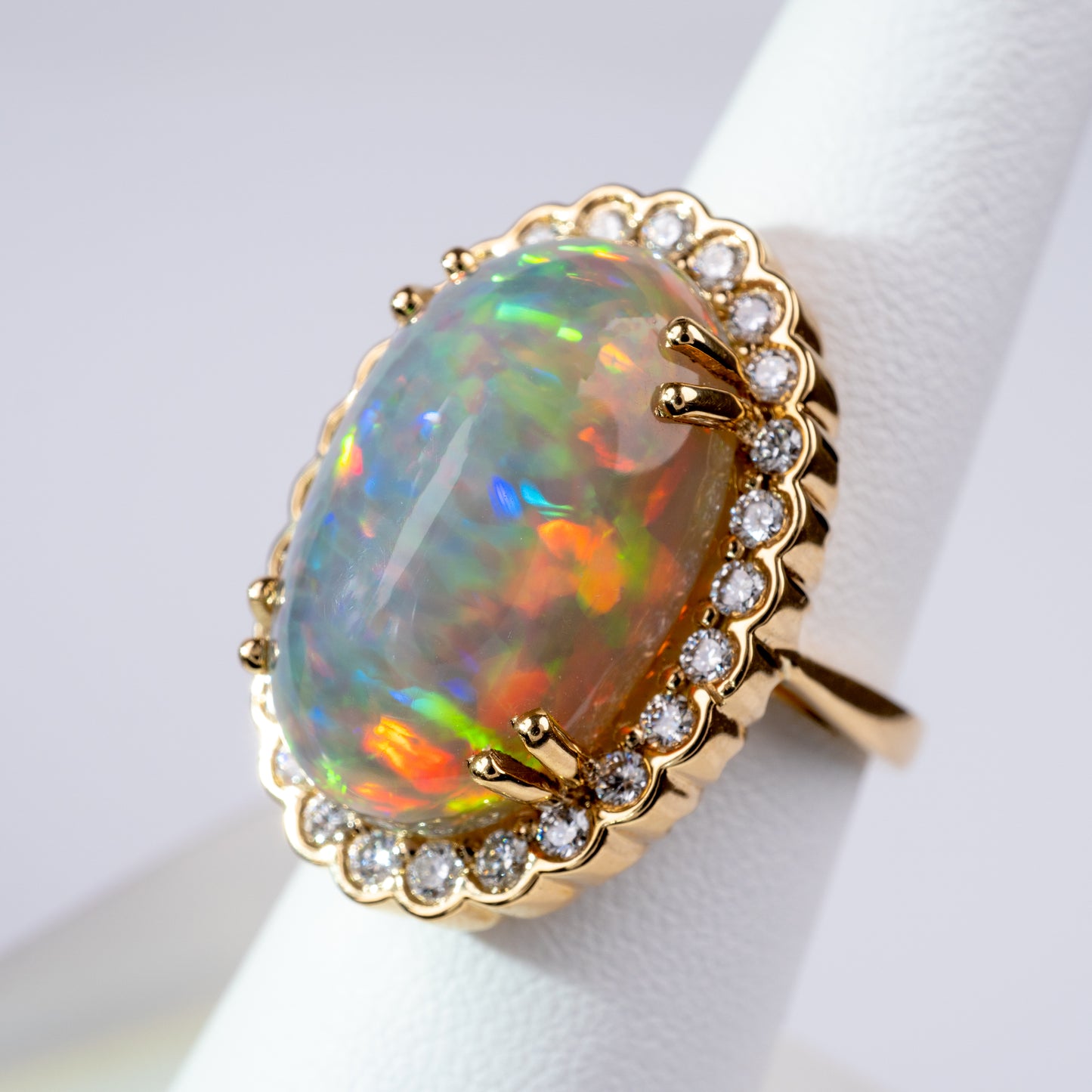 ethiopian opal ring gold and diamond side