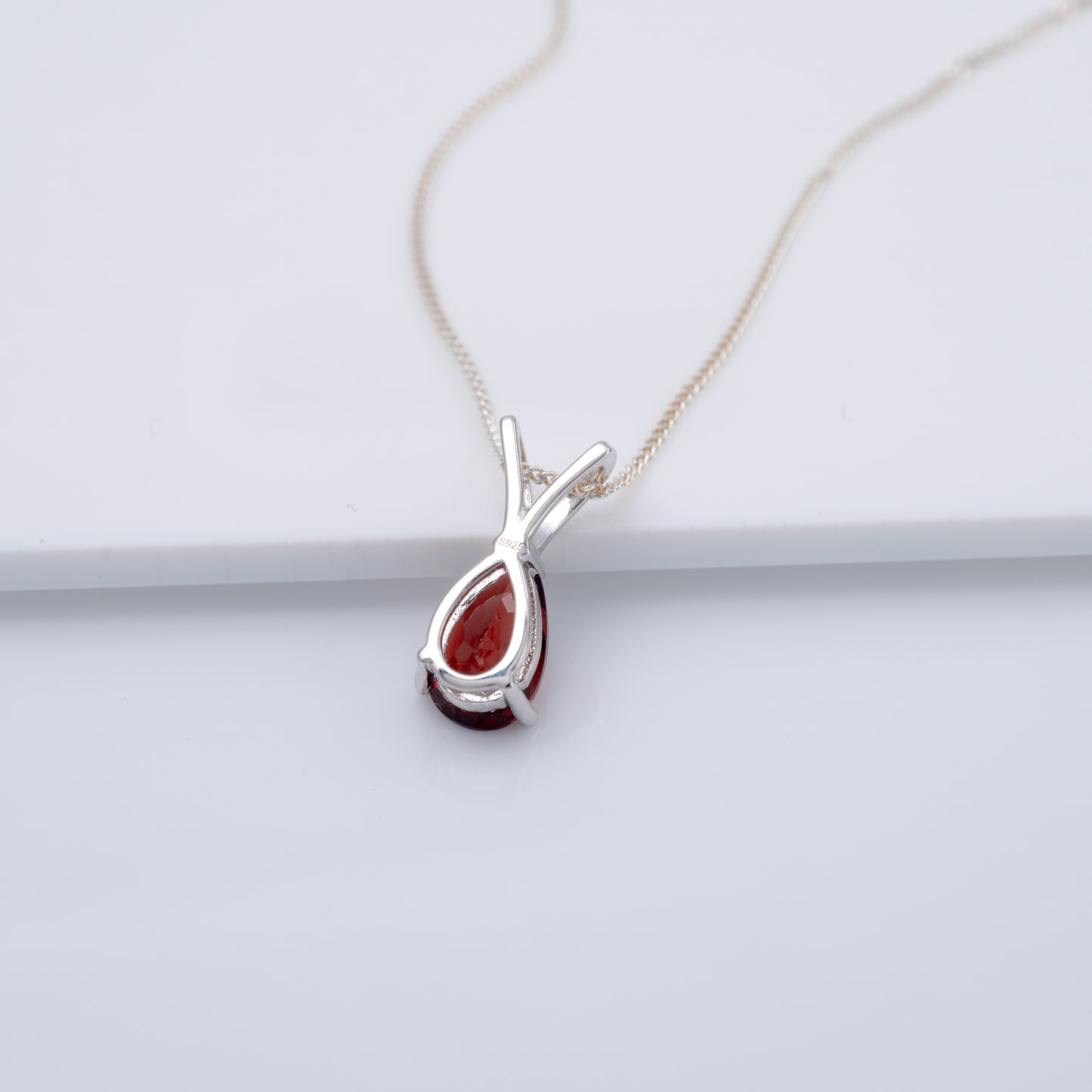 Red garnet teardrop necklace silver reverse