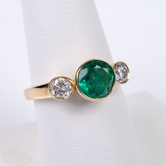 Emerald diamond three-stone engagement dress ring