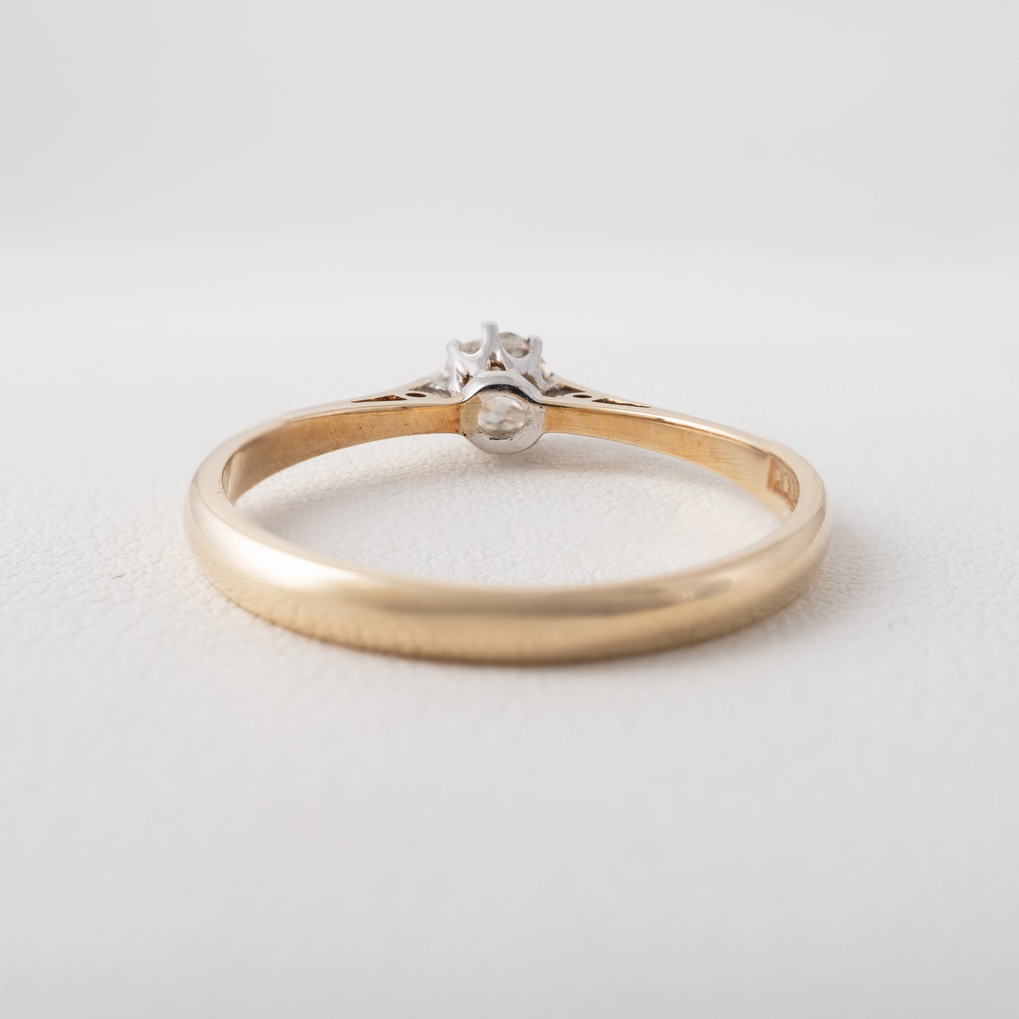 Back view of a vintage diamond solitaire engagement ring showcasing the 9ct gold shank and European cut diamond set in white gold – Hunters Fine Jewellery