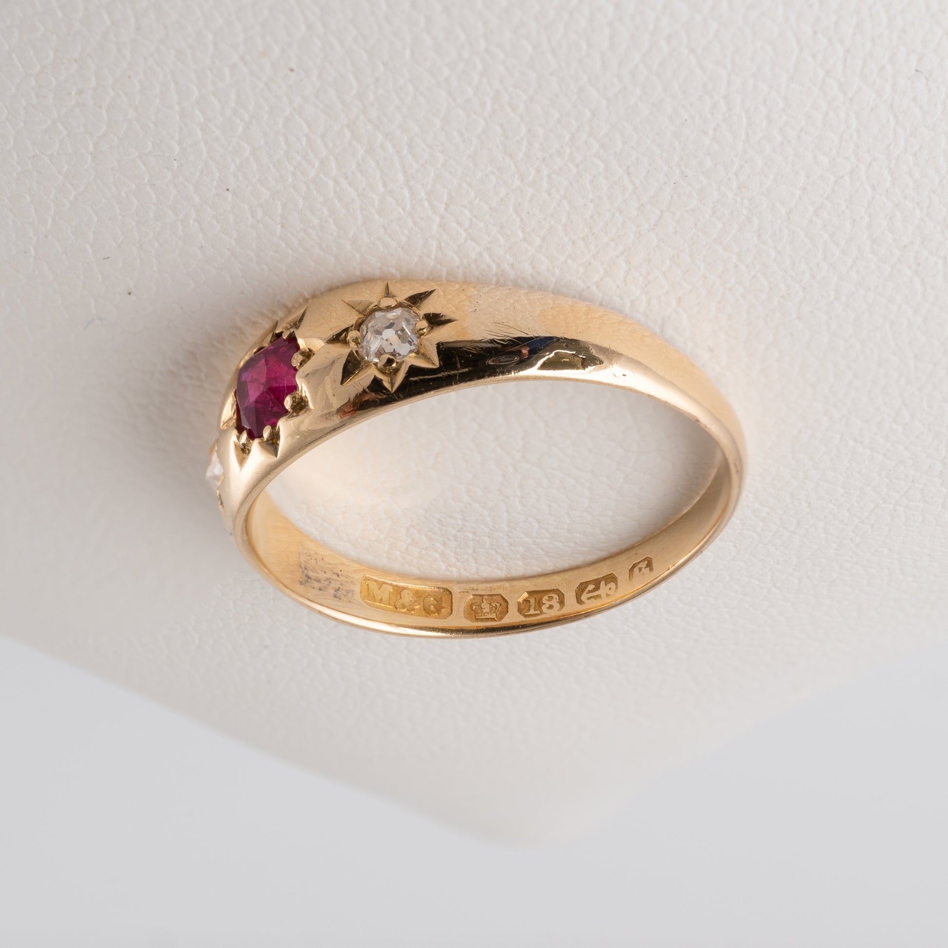 Antique 18ct gold gypsy ring with ruby and diamond, featuring star settings and original hallmarks