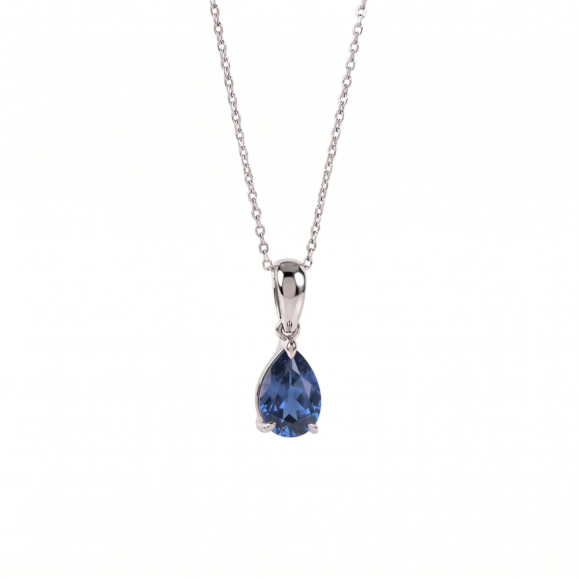 A silver pendant necklace featuring a teardrop-shaped blue gemstone in a prong setting, suspended from a delicate silver chain against a plain white background.