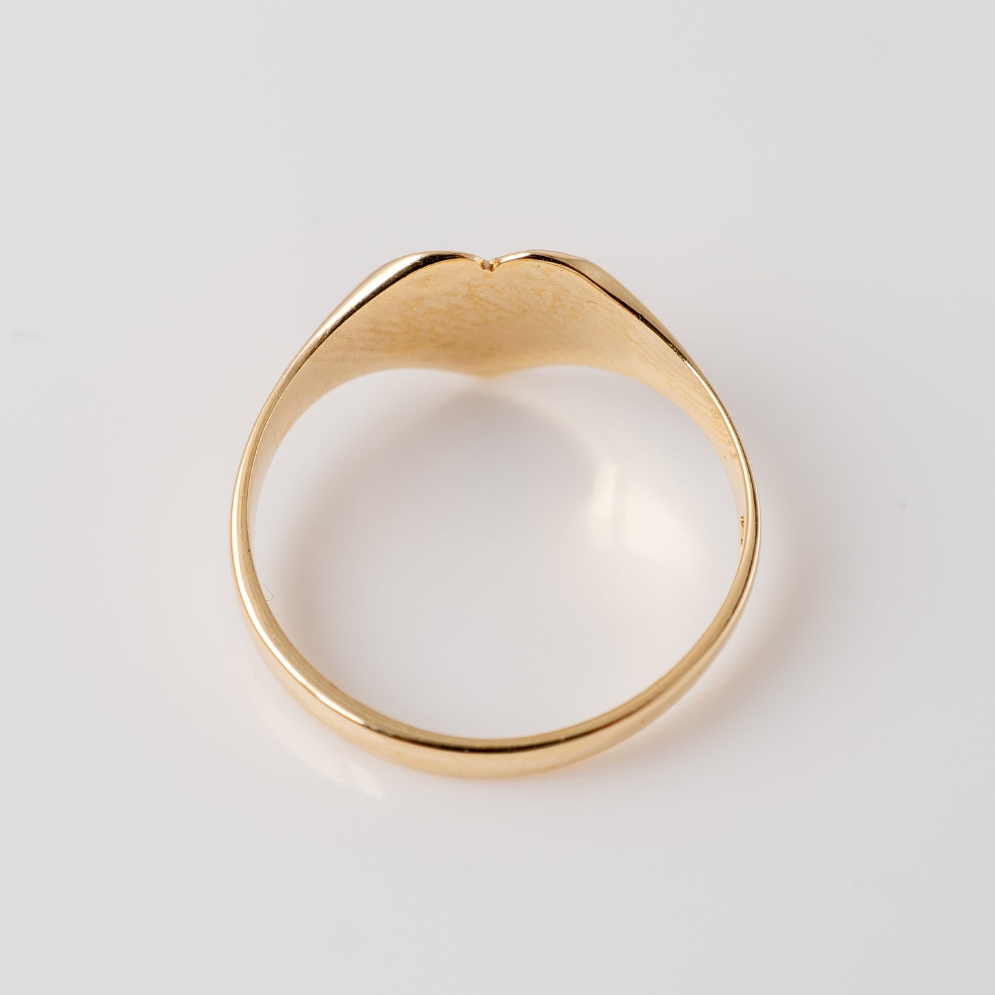 375 gold heart signet ring – back view showing smooth band and inner detailing.