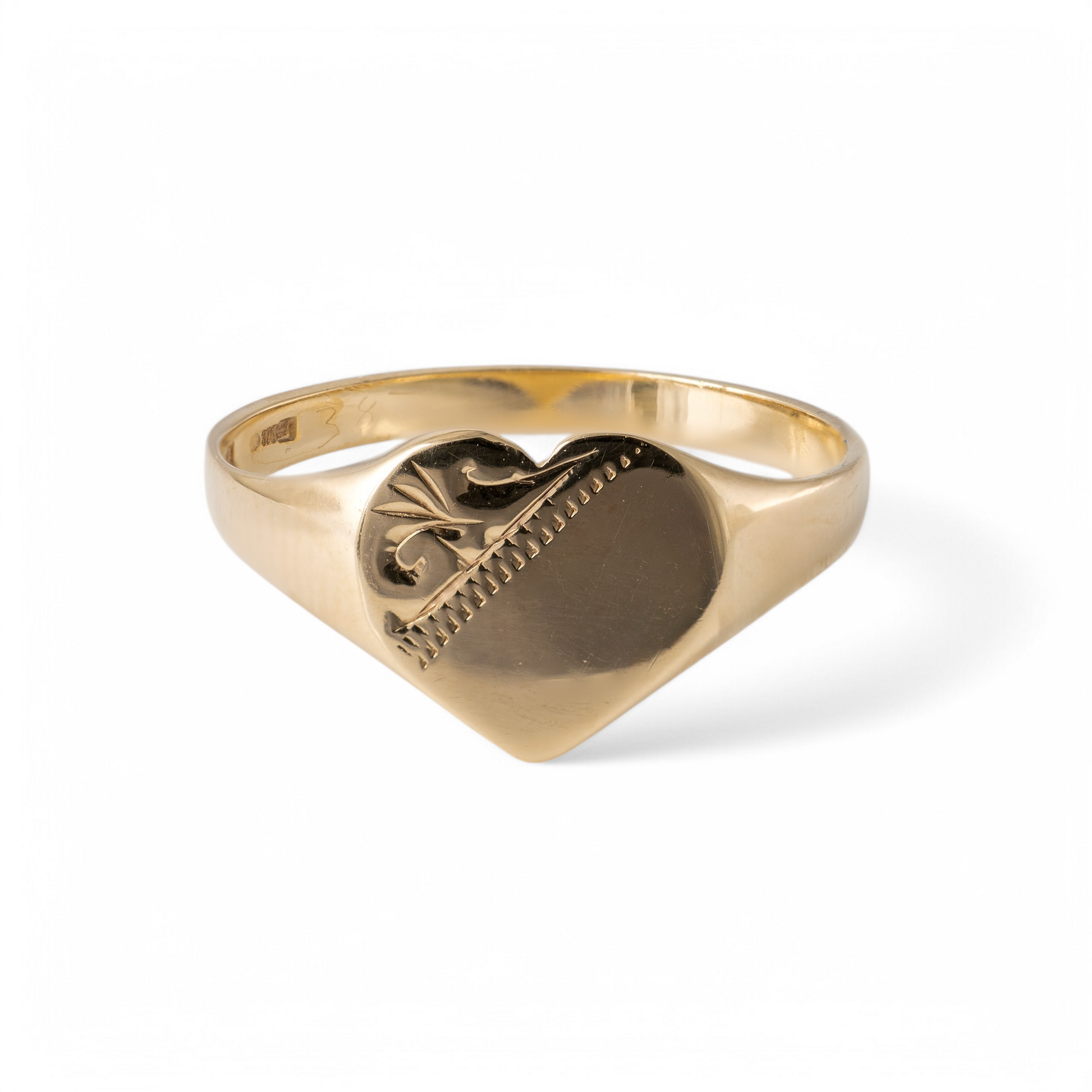 375 gold heart signet ring – engraved detailing and polished finish on white background.