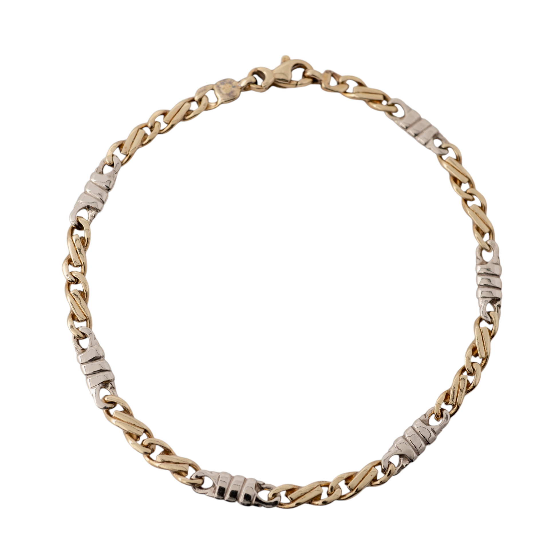 9ct yellow and white figaro bracelet gold by Hunters Fine Jewellery on display