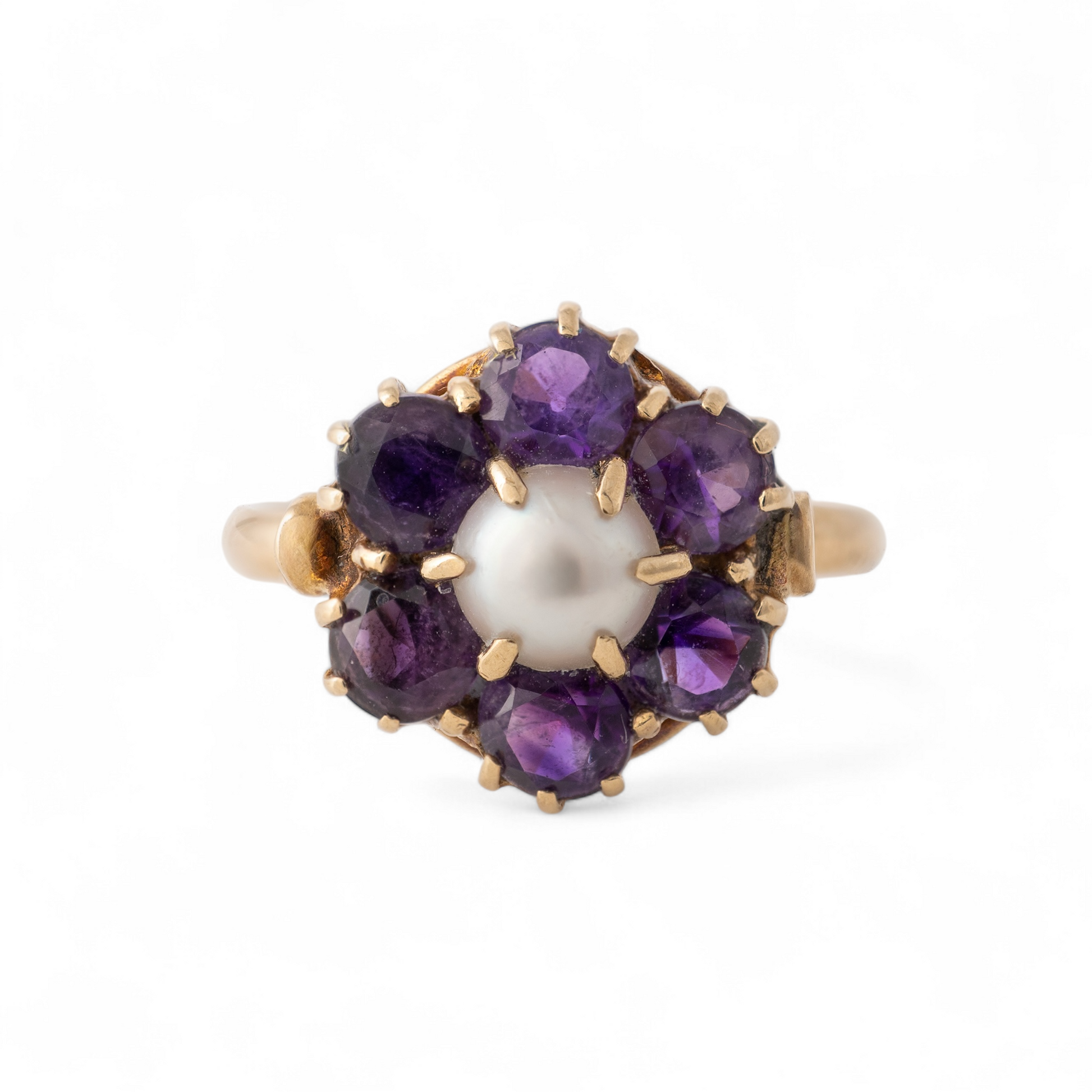 Front view of vintage amethyst and pearl flower ring in 9ct yellow gold.