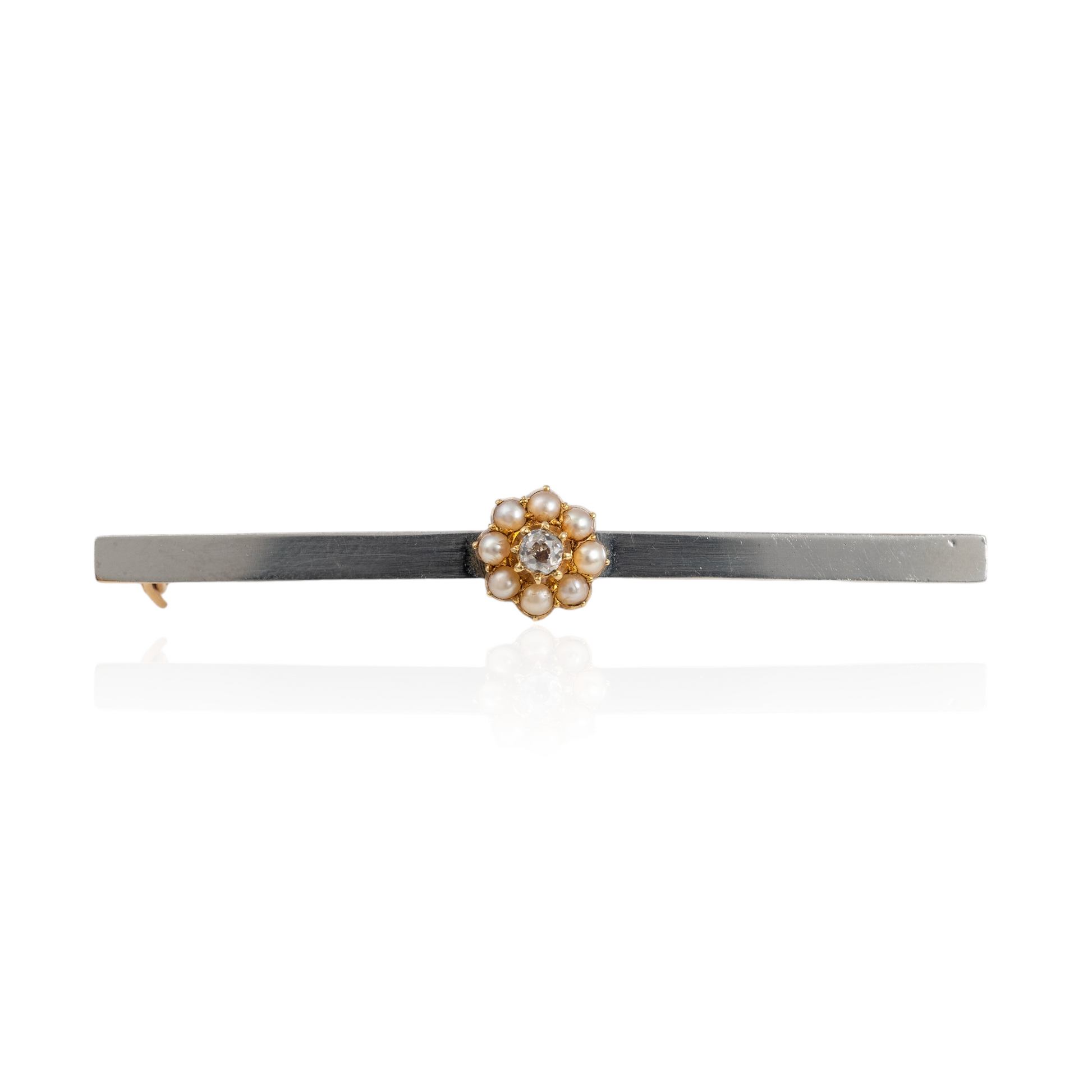 Antique diamond brooch with a pearl halo on a 15ct gold bar and platinum front