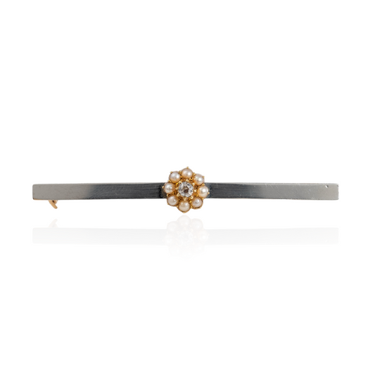 Antique diamond brooch with a pearl halo on a 15ct gold bar and platinum front