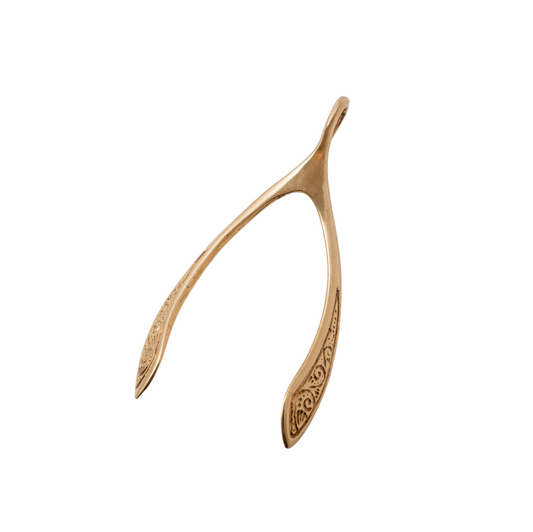 Front view of a large vintage gold wishbone pendant featuring intricate scroll detailing, crafted in solid 9ct yellow gold