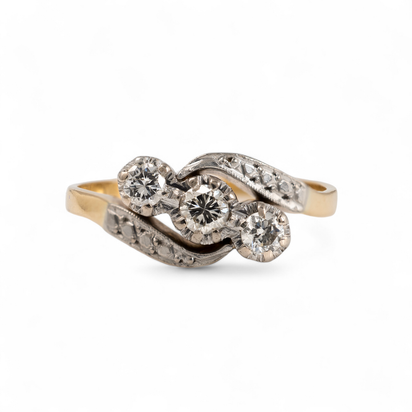 Front view of vintage three stone diamond ring with twist shoulder setting