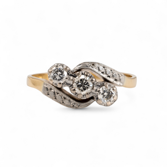 Front view of vintage three stone diamond ring with twist shoulder setting