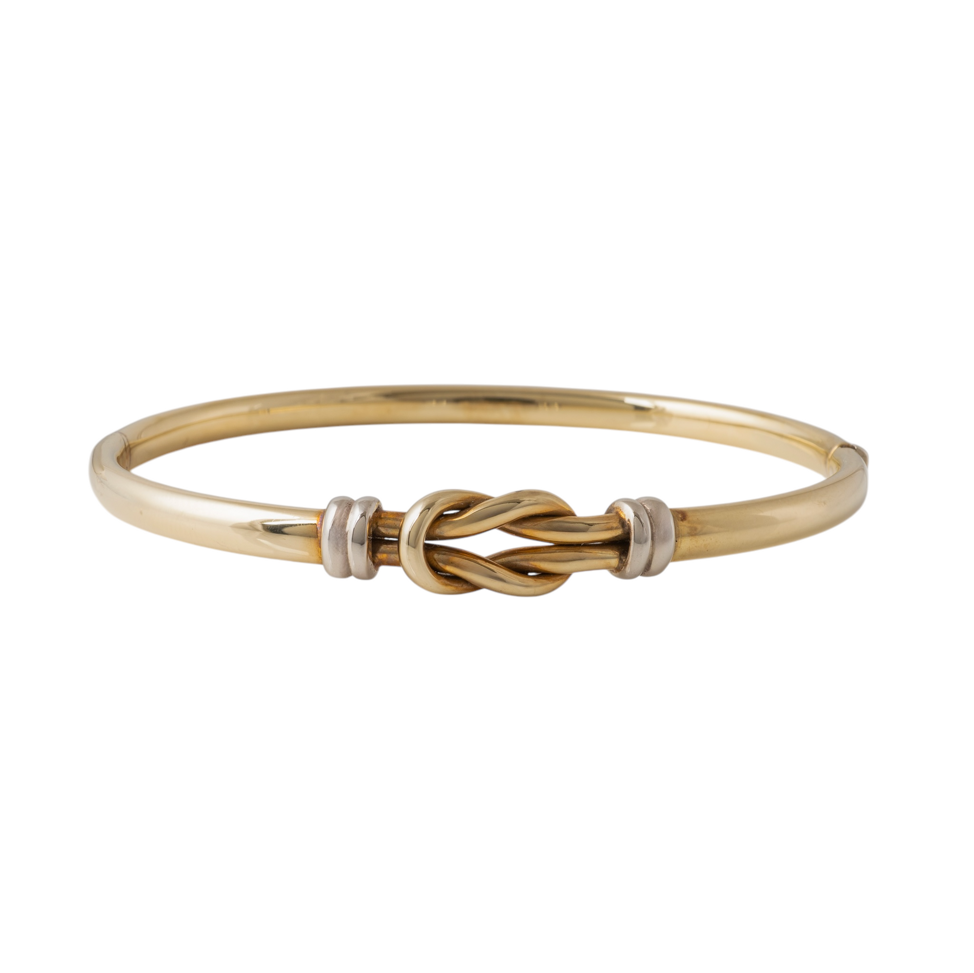 A 9ct gold loop knot bangle with white gold detail, showcasing the front view on a white background