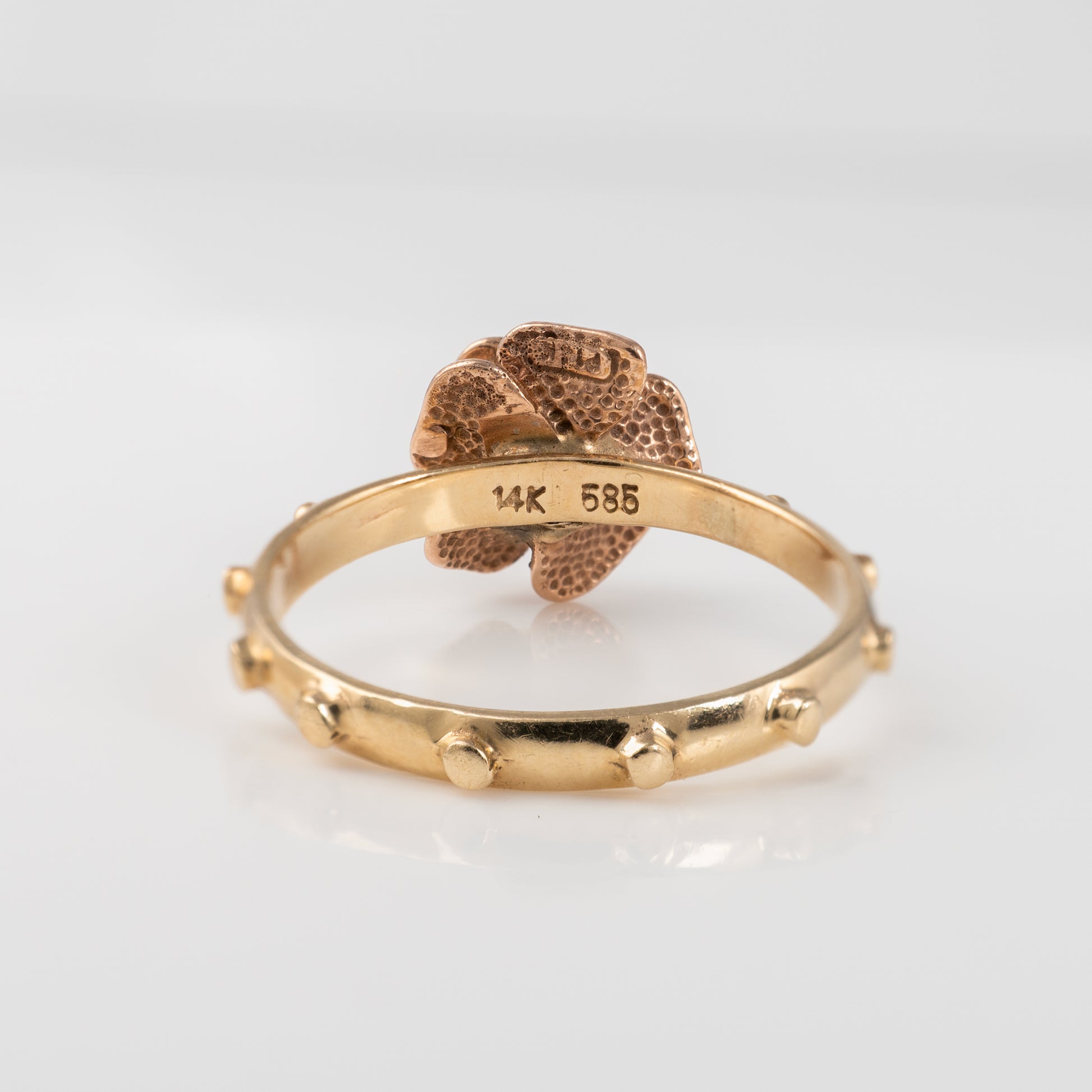 Hallmarked 14K gold rosary ring with rose gold design and ruby