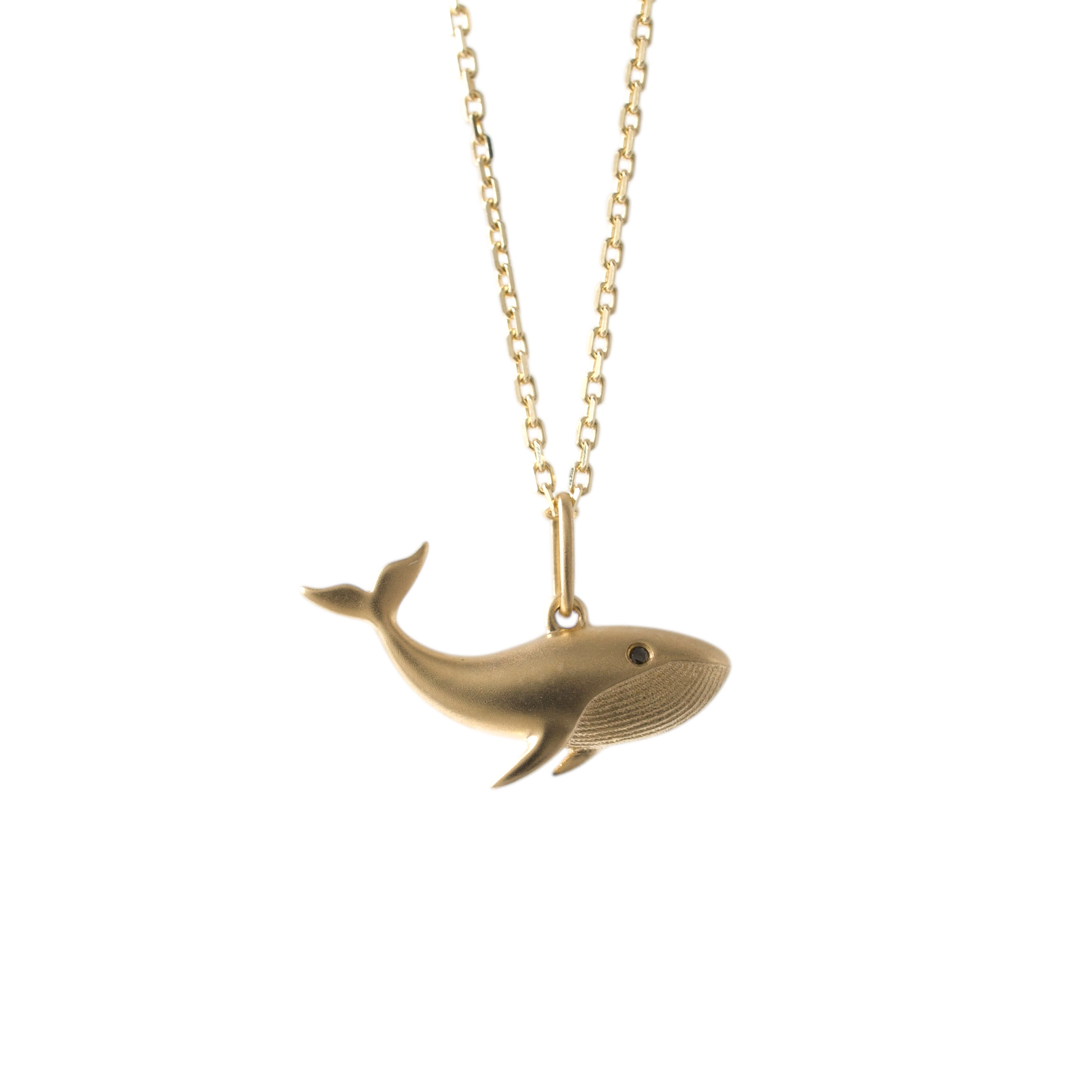 Matte gold whale necklace on an adjustable chain hunters fine jewellery