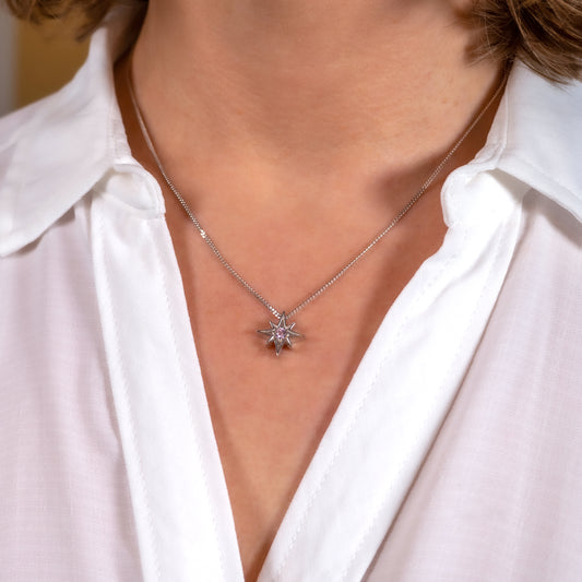 Pink cubic zirconia North Star necklace worn on model – celestial jewellery