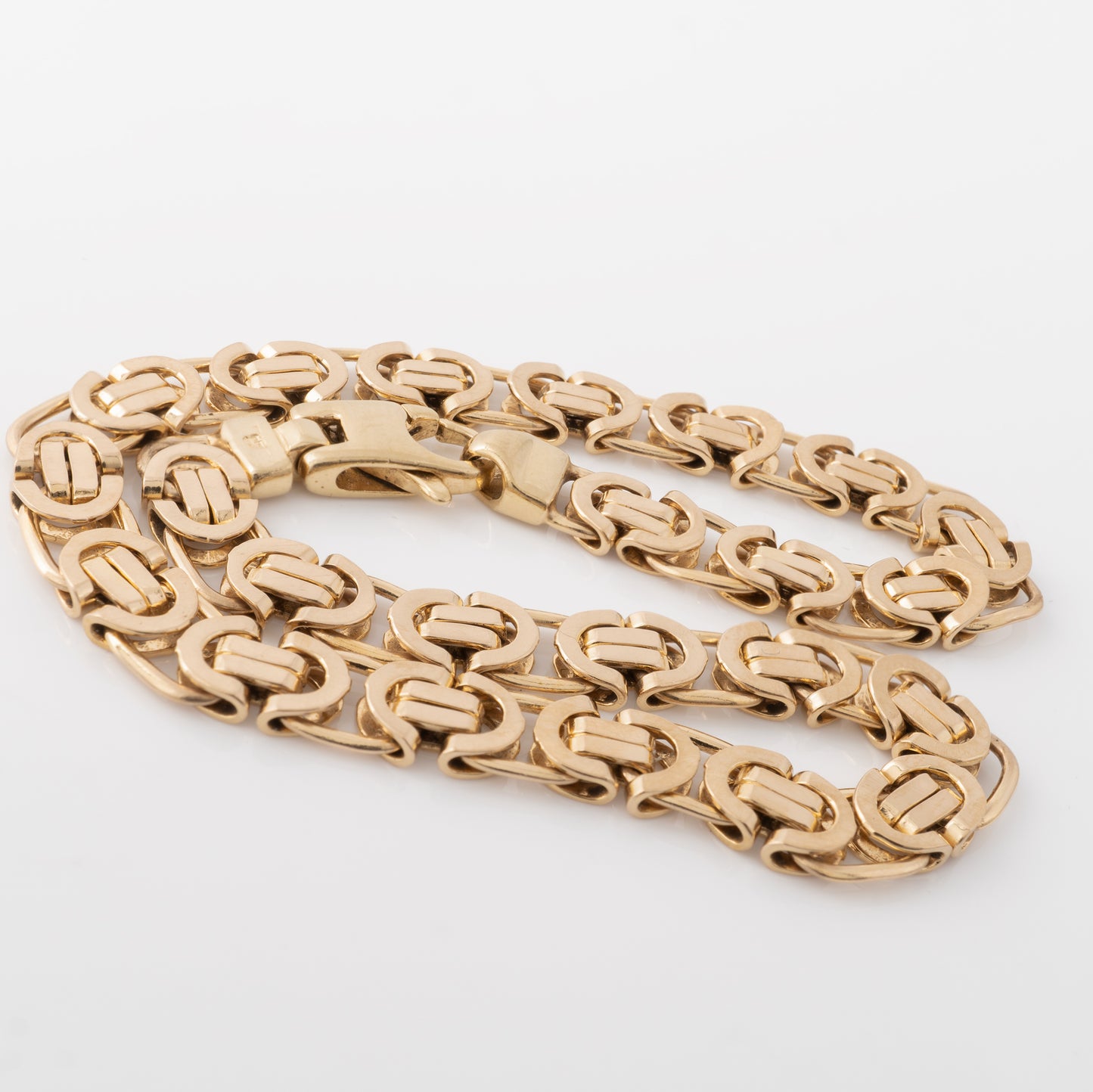 Pre-owned gold bracelet showcasing flat Byzantine-style links