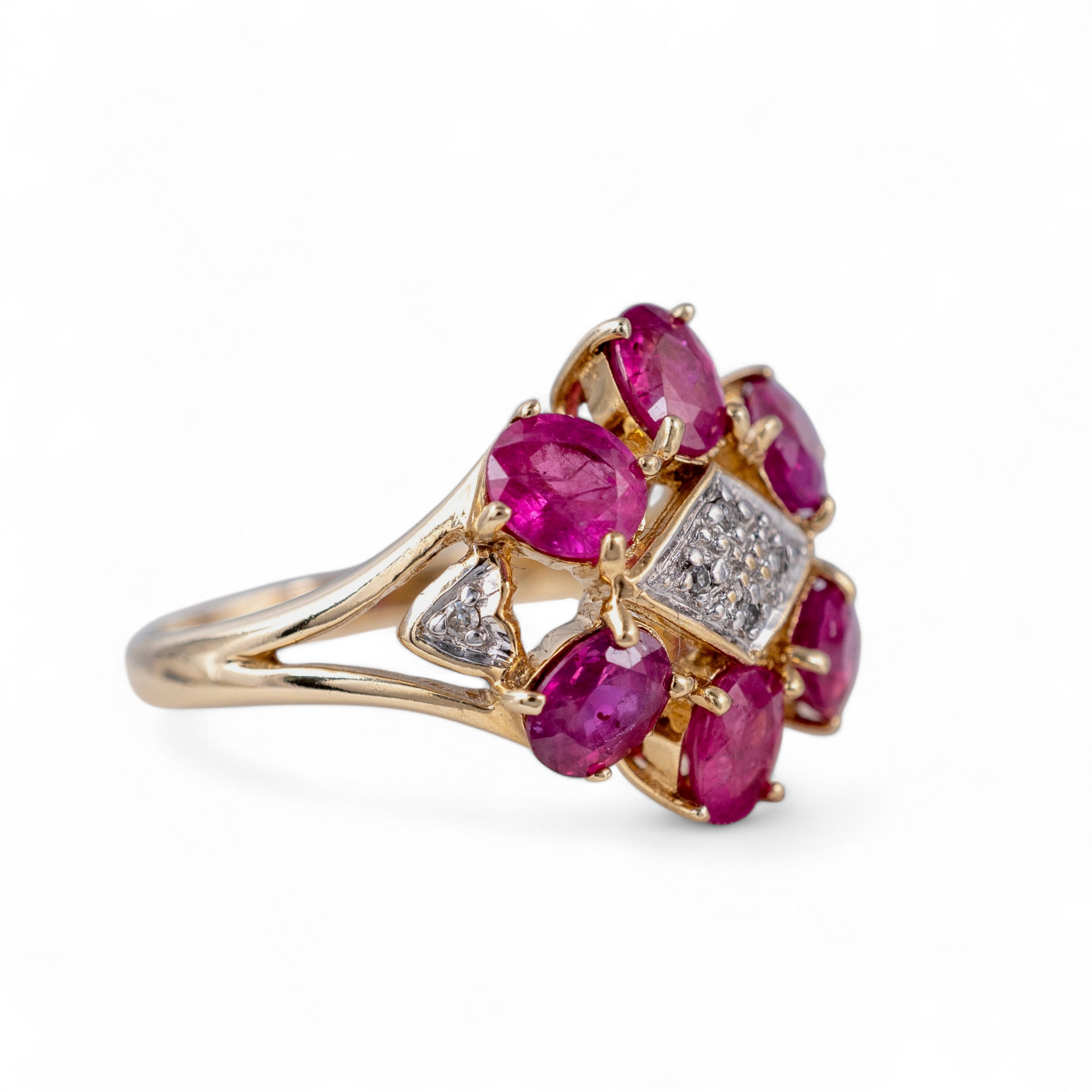 Ruby flower ring cllose up side view showing rubies and diamonds