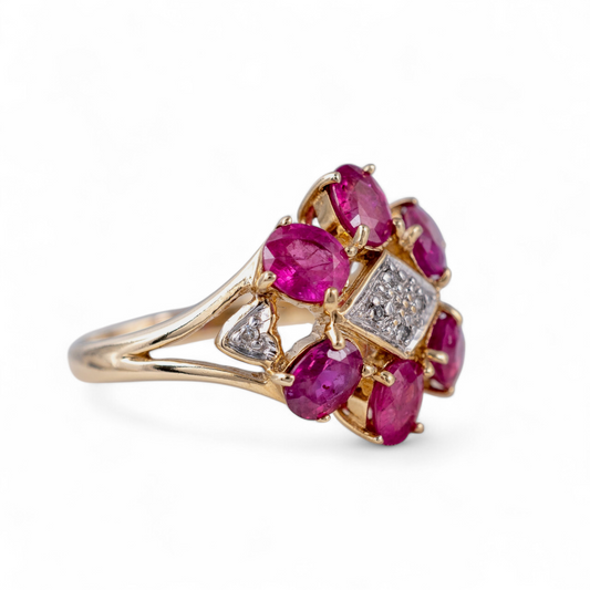 Ruby flower ring cllose up side view showing rubies and diamonds