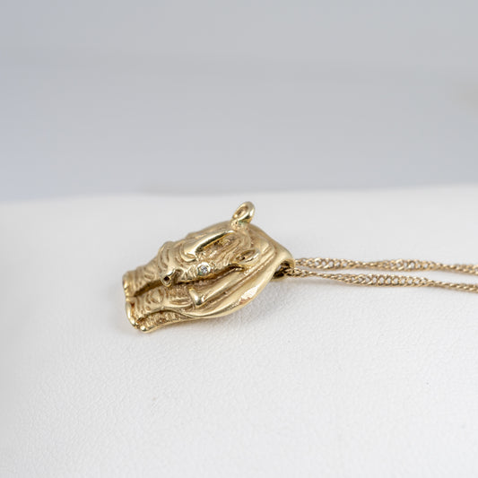 Side view of Gold Rhino Animal Pendant showing detailed rhino features
