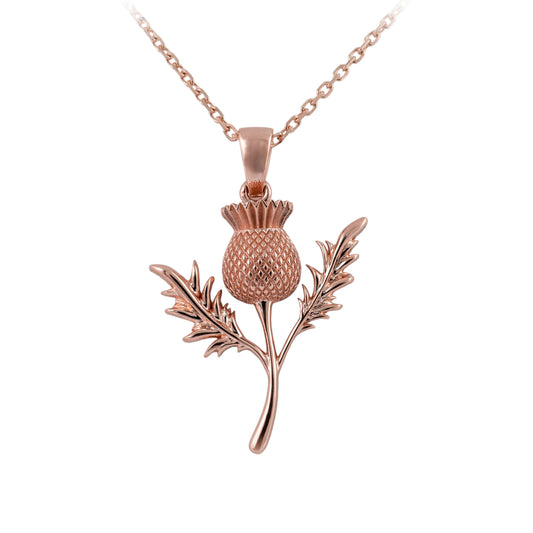 Rose gold thistle pendant on a chain against a white background