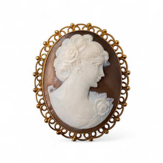Vintage 9ct gold shell cameo brooch with decorative border 
