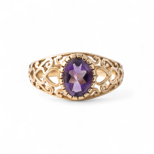 Vintage amethyst ring with hearts detail in 9ct gold, showcasing intricate openwork design