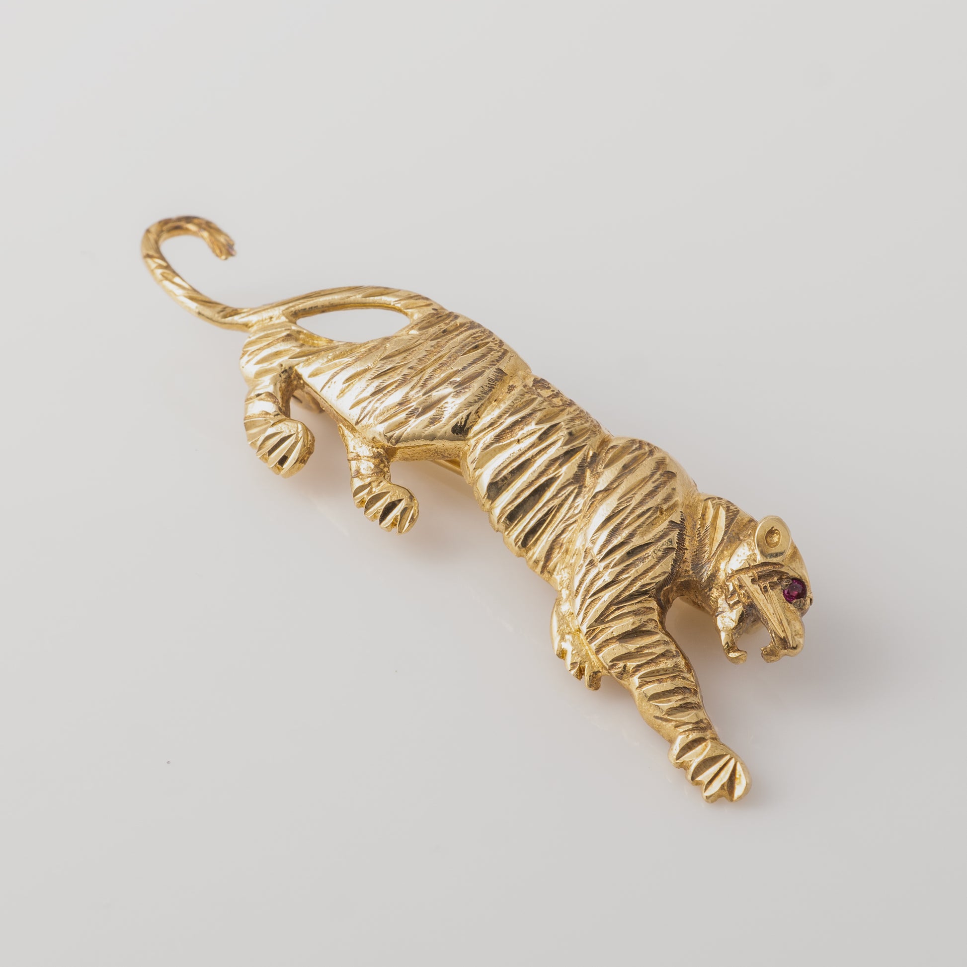 Vintage gold tiger brooch pin with ruby eye