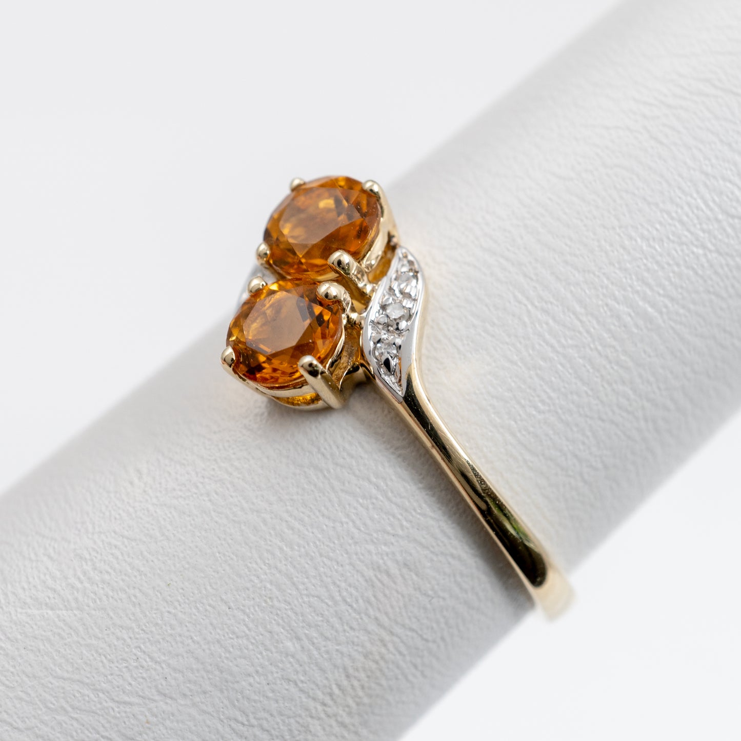 White gold shoulders with diamonds on a gold Citrine ring