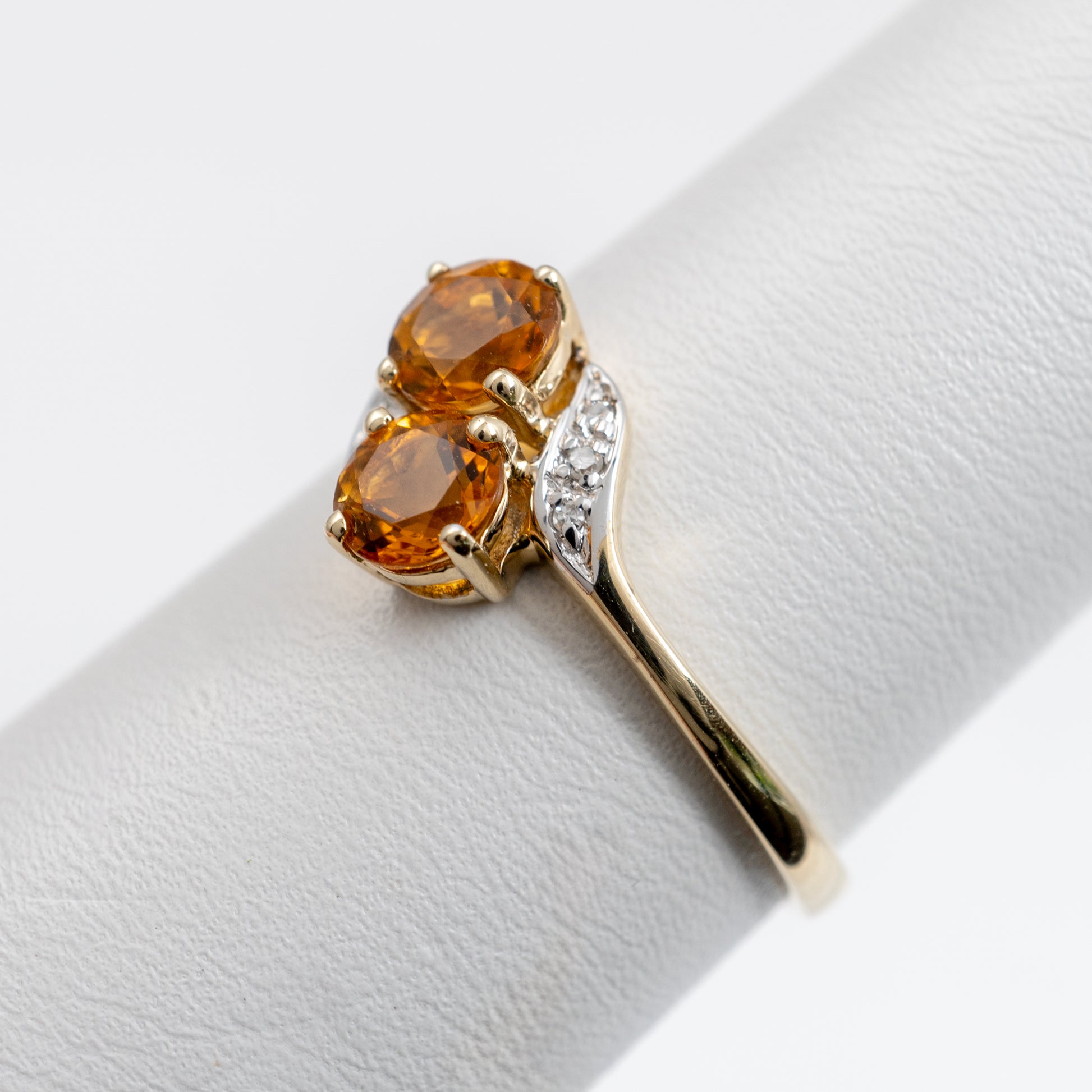 White gold shoulders with diamonds on a gold Citrine ring