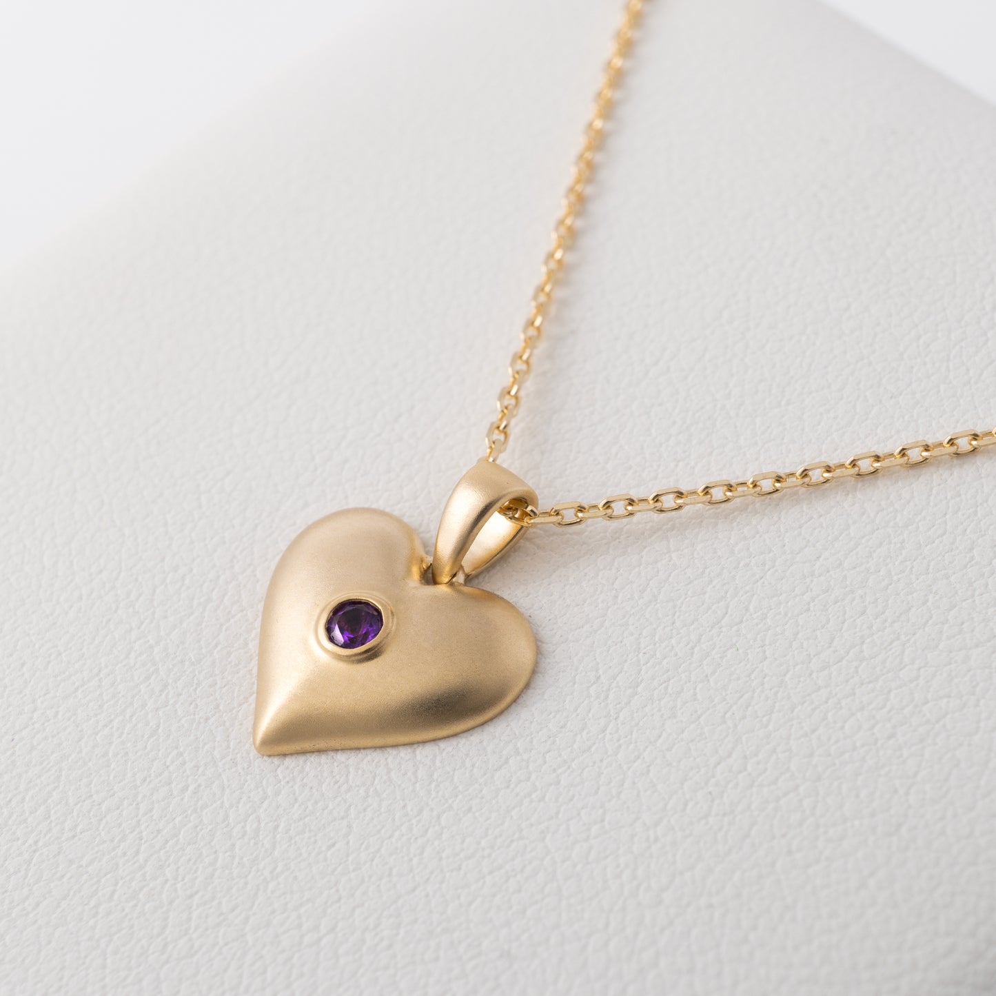 Side view of amethyst heart necklace pendant in matte gold – Hunters Fine Jewellery