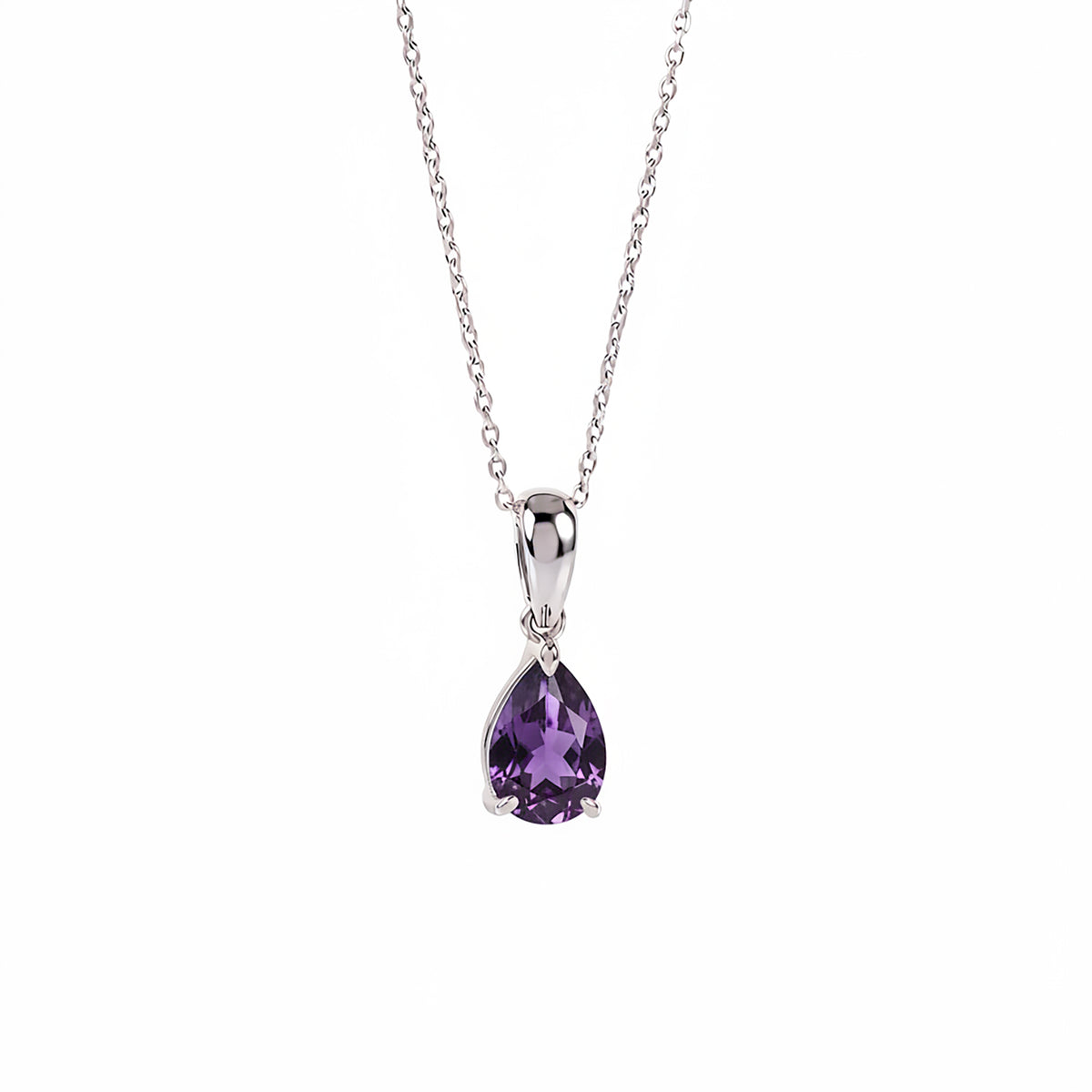 Sterling silver pendant with a natural pear-cut amethyst in a geometric prong setting, resting on a clean white surface.