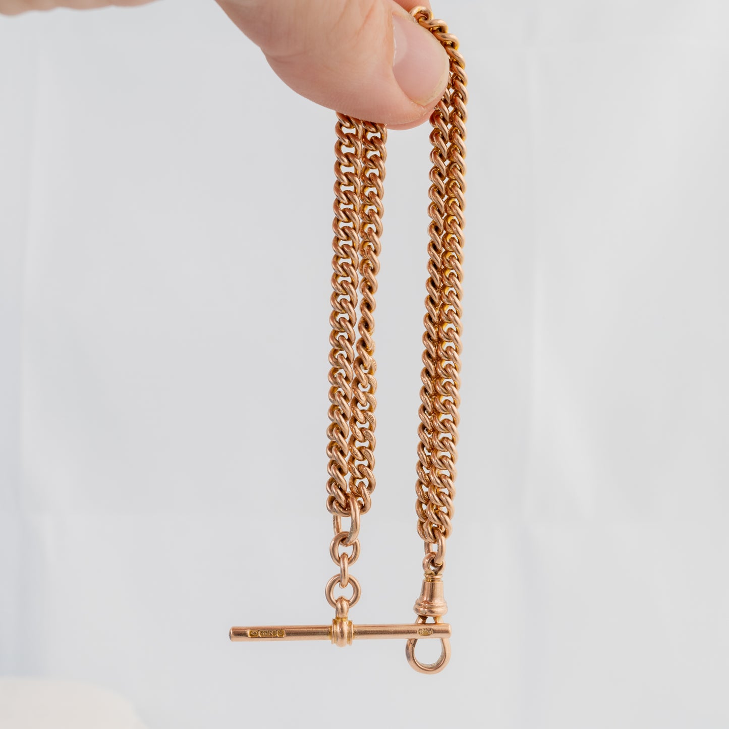 Product video of an antique 9ct rose gold Double Albert watch chain showing the original T-bar, dog clip and hallmarked curb links