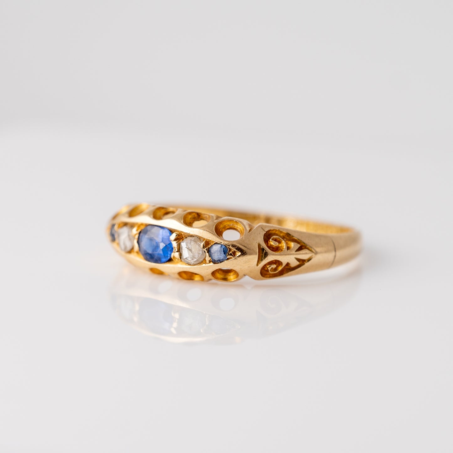 antique sapphire and diamond ring showing the scroll detailed shoulders 