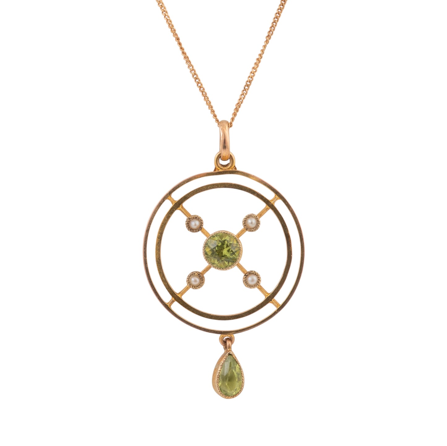 A gold pendant necklace featuring a circular geometric design with a central green peridot gemstone, small clear accent stones, and a dangling teardrop-shaped green gemstone, shown on a plain white background.