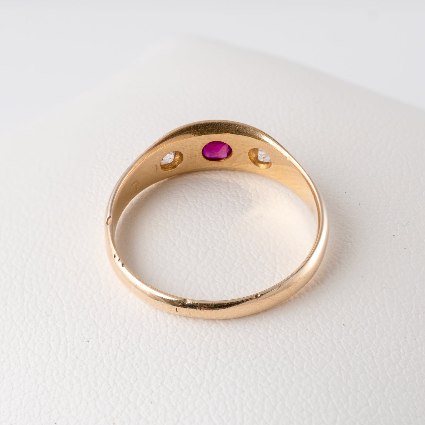 Antique 18ct gold gypsy ring with ruby and diamonds, underside view showing open back settings