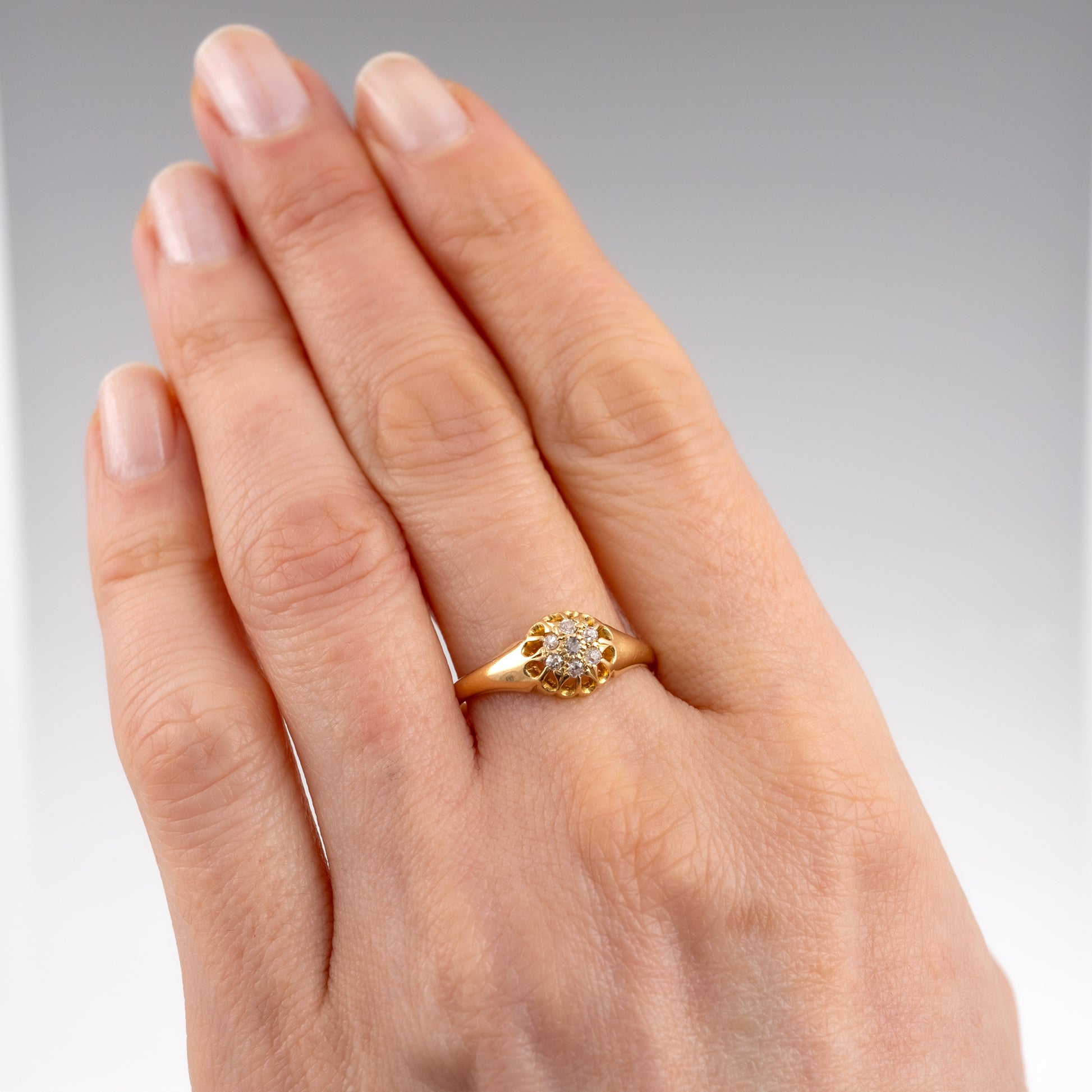 Exquisite antique 18ct gold diamond cluster ring worn on hand
