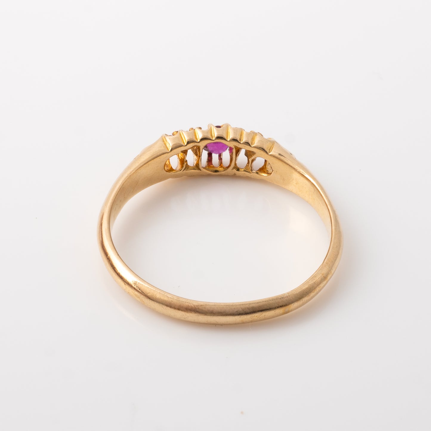 Back view of an Edwardian ruby and diamond ring in 18ct yellow gold, showcasing the clean shank and craftsmanship